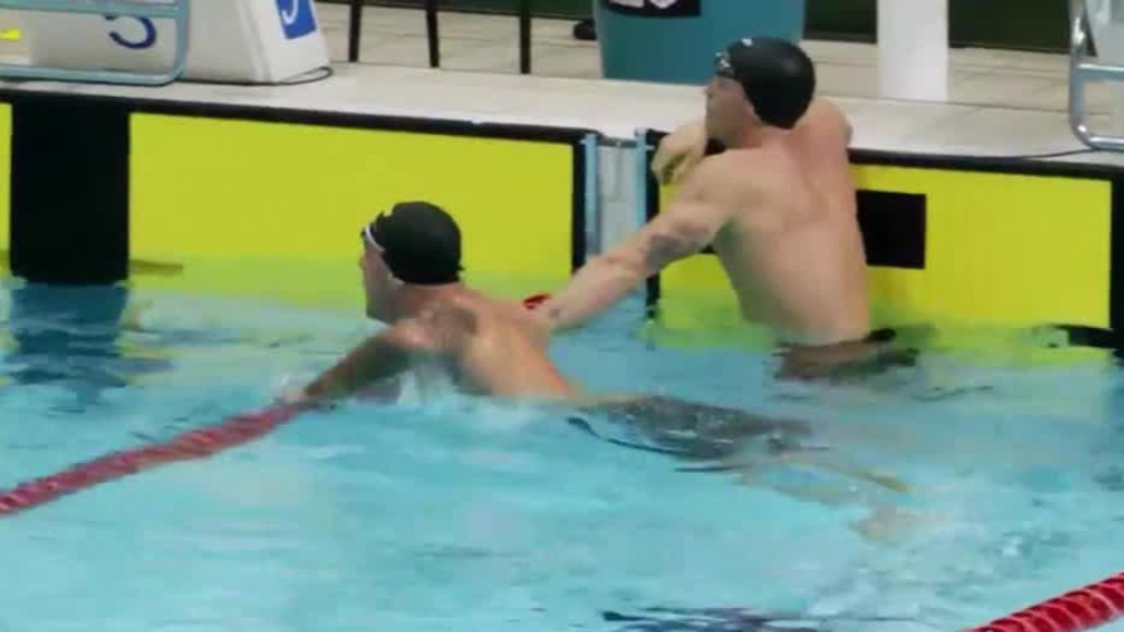 Kyle Chalmers brushes past Cody Simpson at the Australian world championship trials.