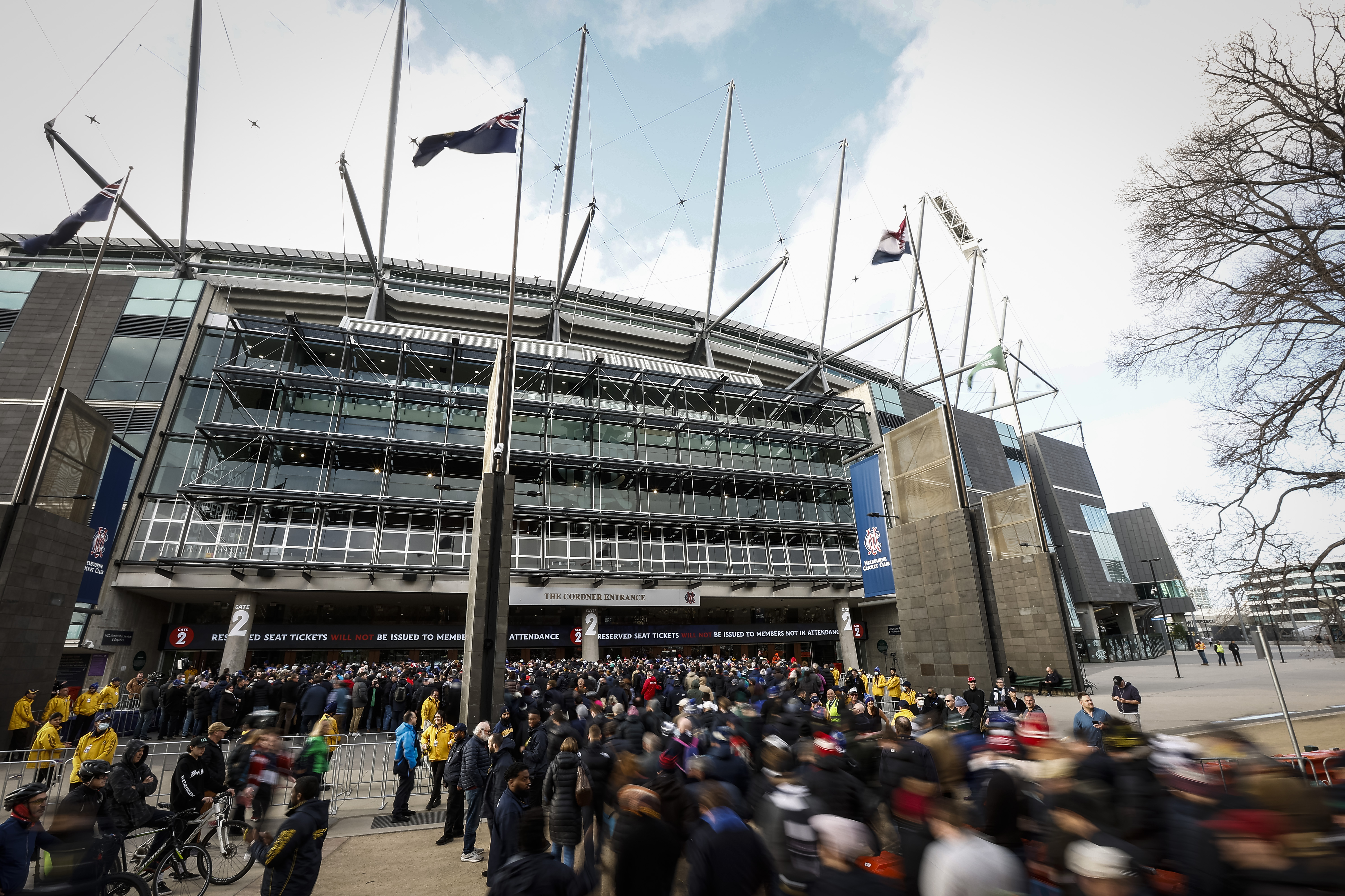 Fans line up at the MCC members entrance before the 2022 AFL Grand Final match between the Geelong Cats and the Sydney Swans at the Melbourne Cricket Ground on September 24, 2022 in Melbourne, Australia. (Photo by Darrian Traynor/AFL Photos/via Getty Images)