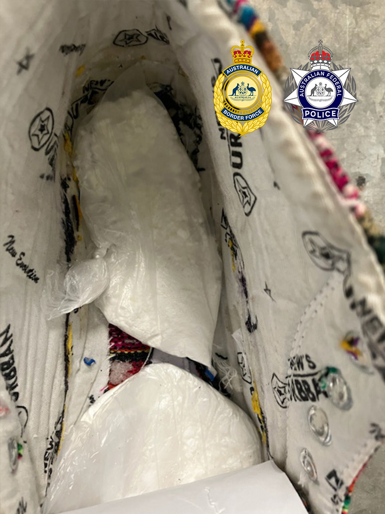 Two men have been sentenced after trying to smuggle 100 grams of cocaine into the Northern Territory, hidden inside sneakers.