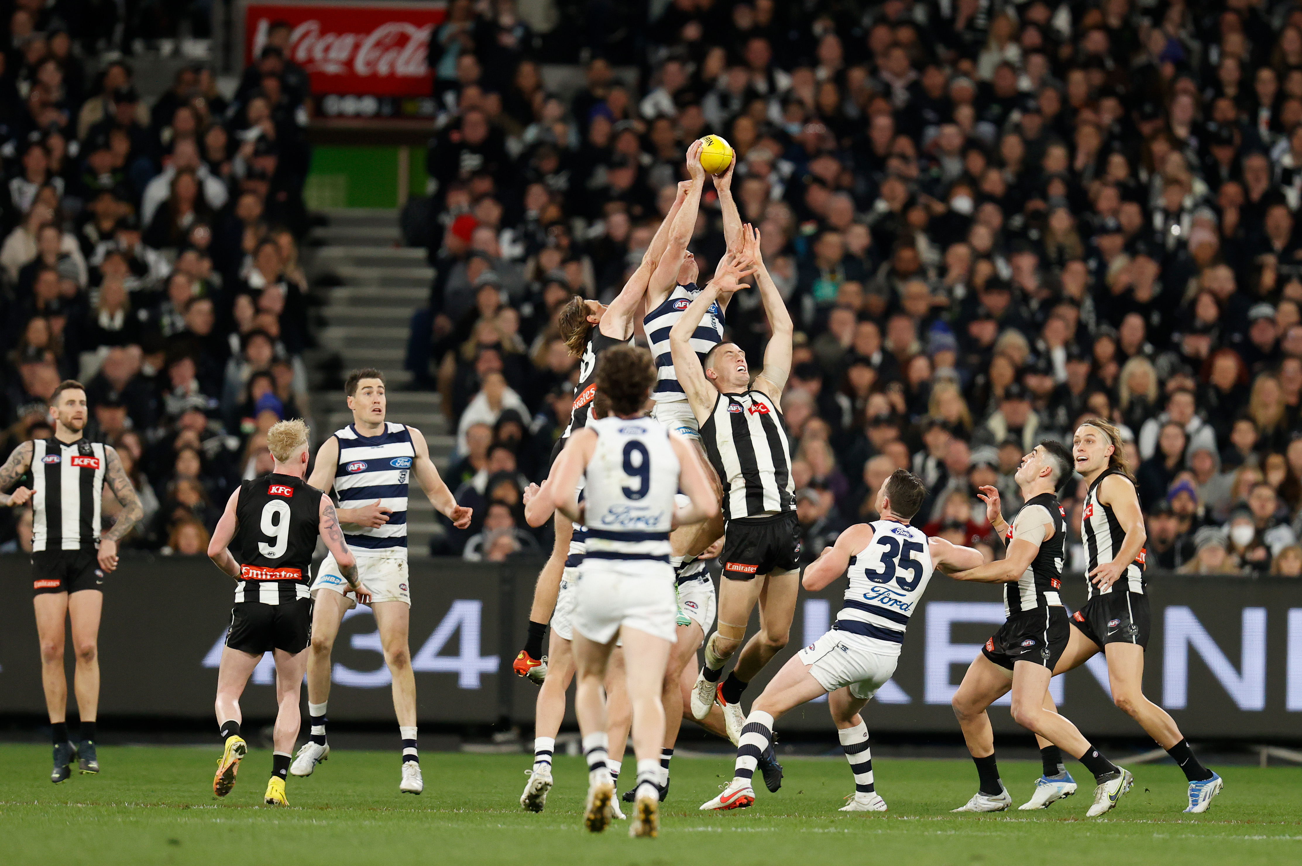 Geelong's Gary Rohan marks the ball over Darcy Cameron of the Magpies.