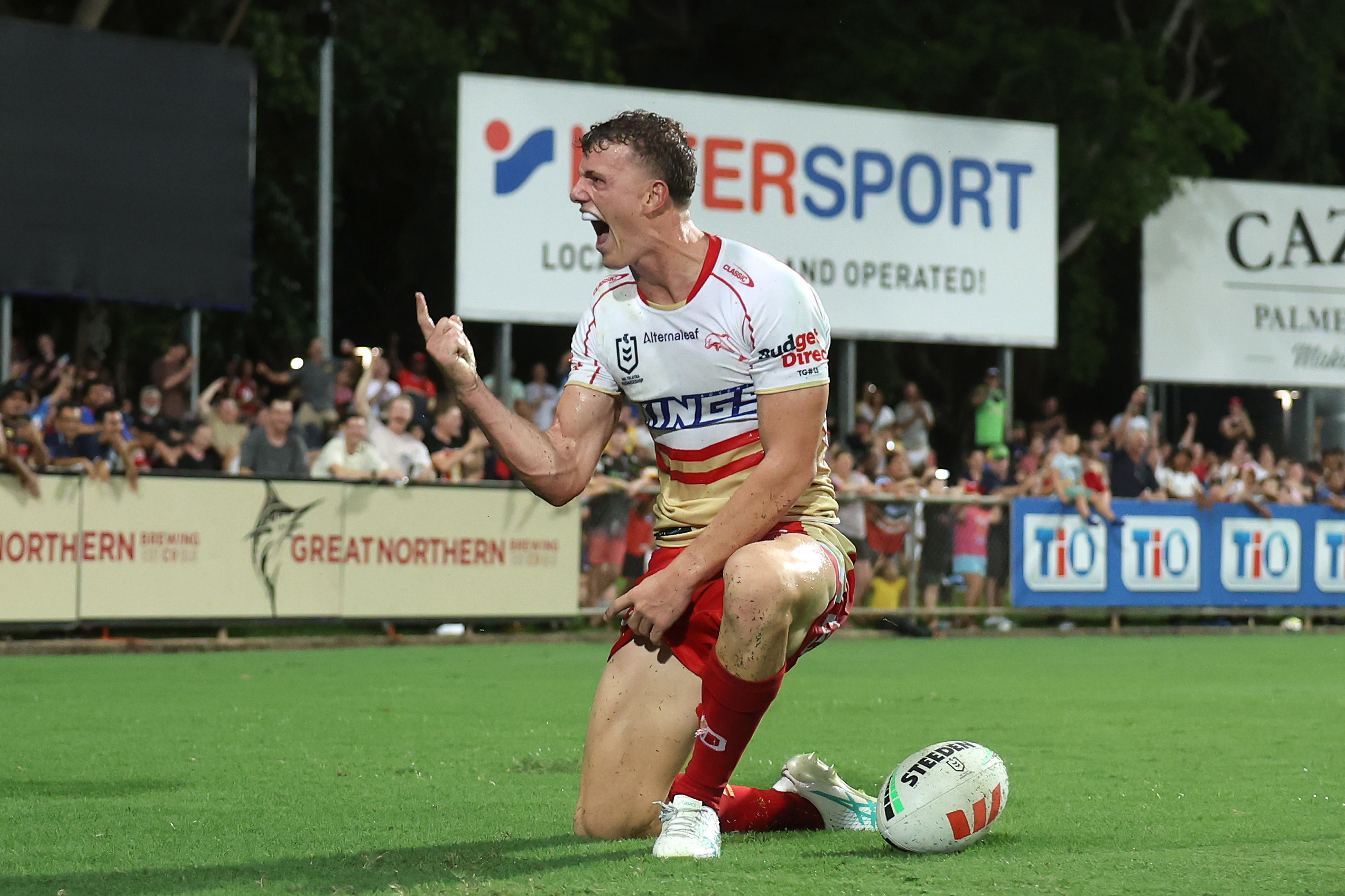 Jack Bostock of the Dolphins celebrates after scoring a try against the Eels.