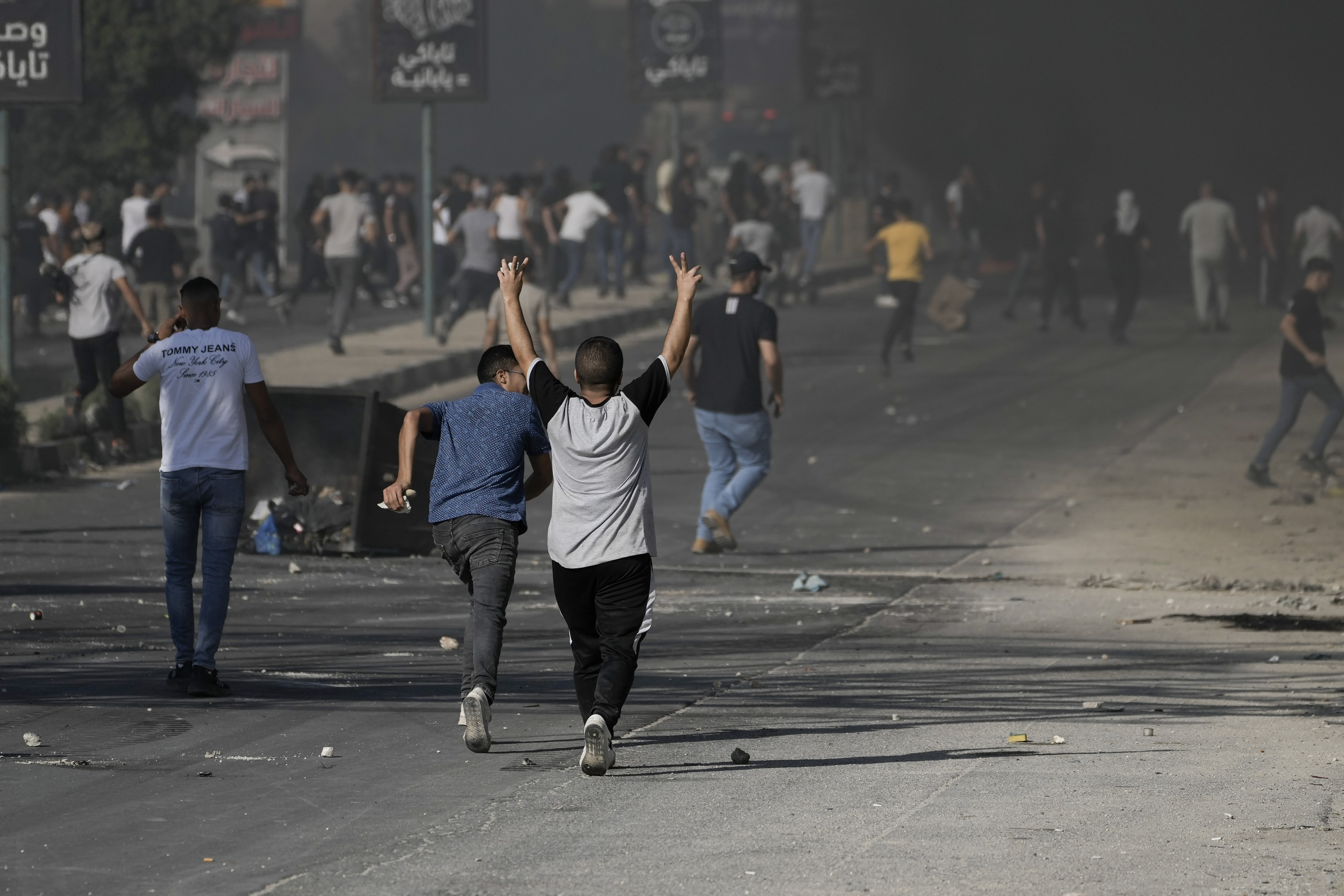 Palestinian demonstrators clash with Israeli forces following a demonstration in support of the Gaza Strip in the West Bank city of Nablus, Friday, Oct. 13, 2023. 