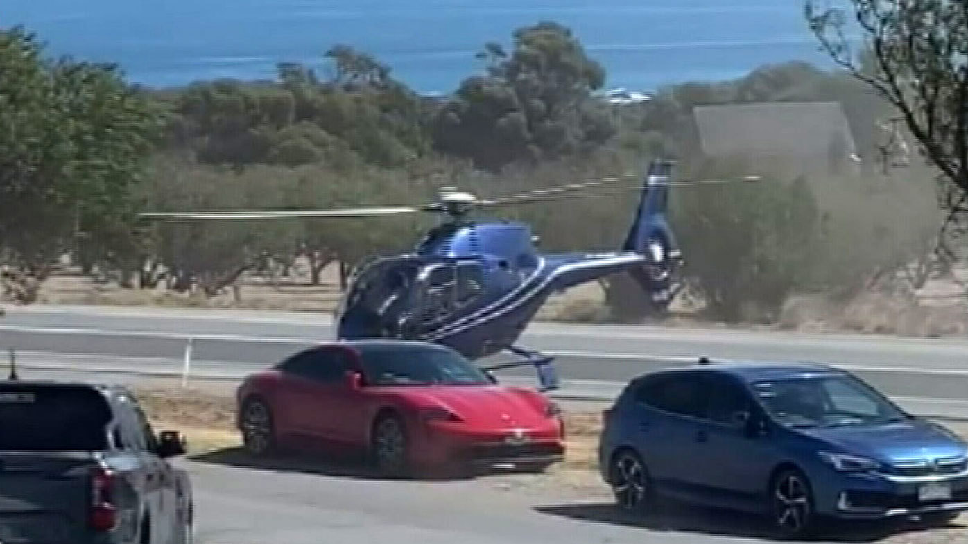 Helicopter hovers over Porsche outside Victory Hotel in Sellicks Hill, south of Adelaide.