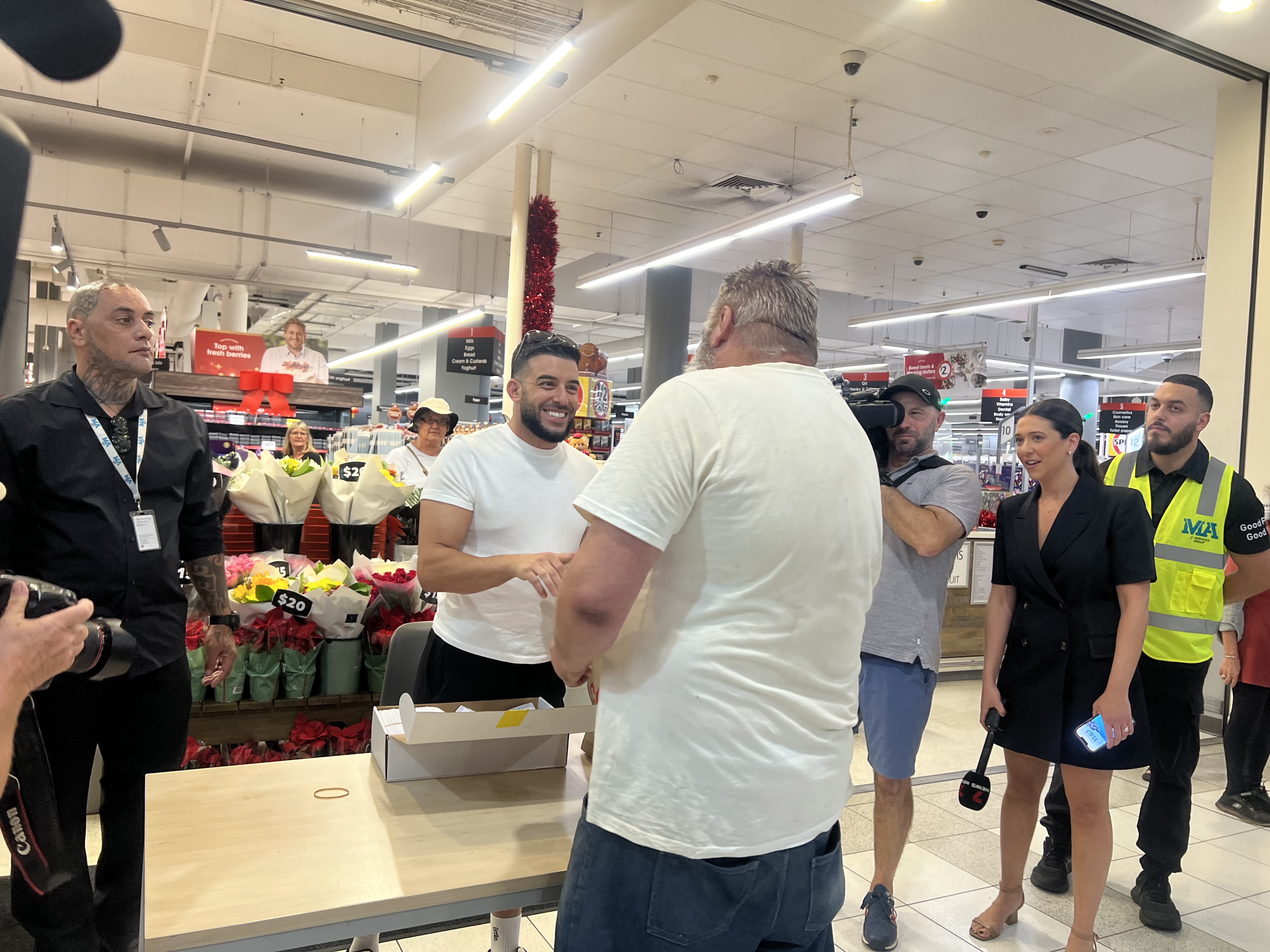 Australians have been lining up all morning to get a slice of billionaire Adrian Portelli's $150,000 giveaway, with the lucky ones planning to use the money to alleviate cost of living pressures.