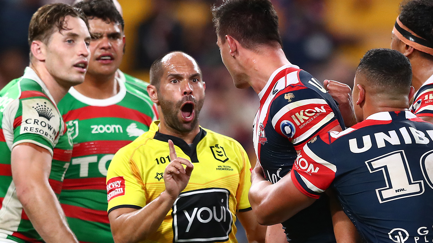 Referee Ashley Klein speaks with Joseph Manu of the Roosters after receiving a high tackle from Latrell Mitchell 