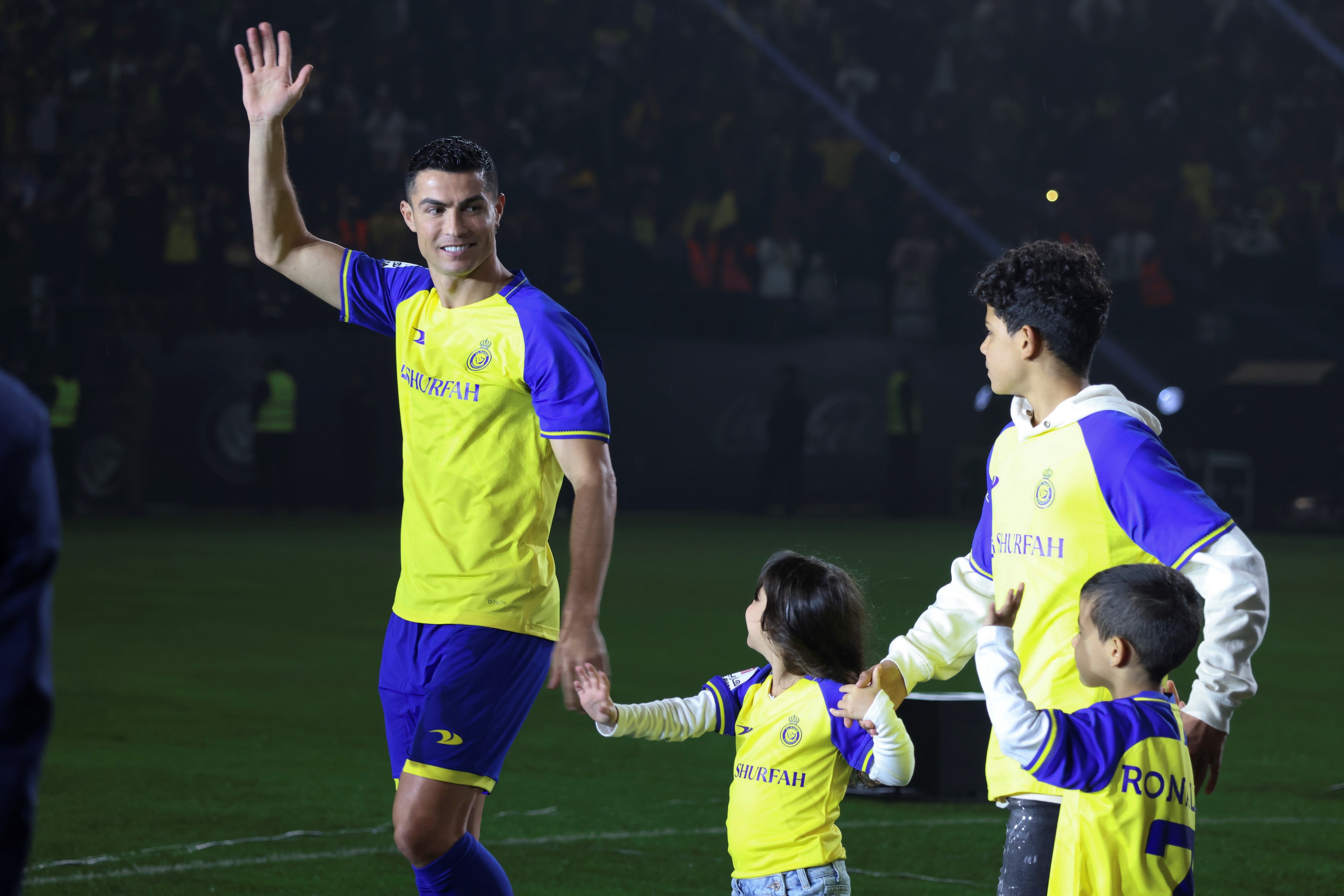 Al-Nassr's Portuguese forward Cristiano Ronaldo L with his family attends his unveiling at the Mrsool Park Stadium in the Saudi Arabia capital Riyadh on Jan. 3, 2023. (Photo by Wang Haizhou/Xinhua via Getty Images)