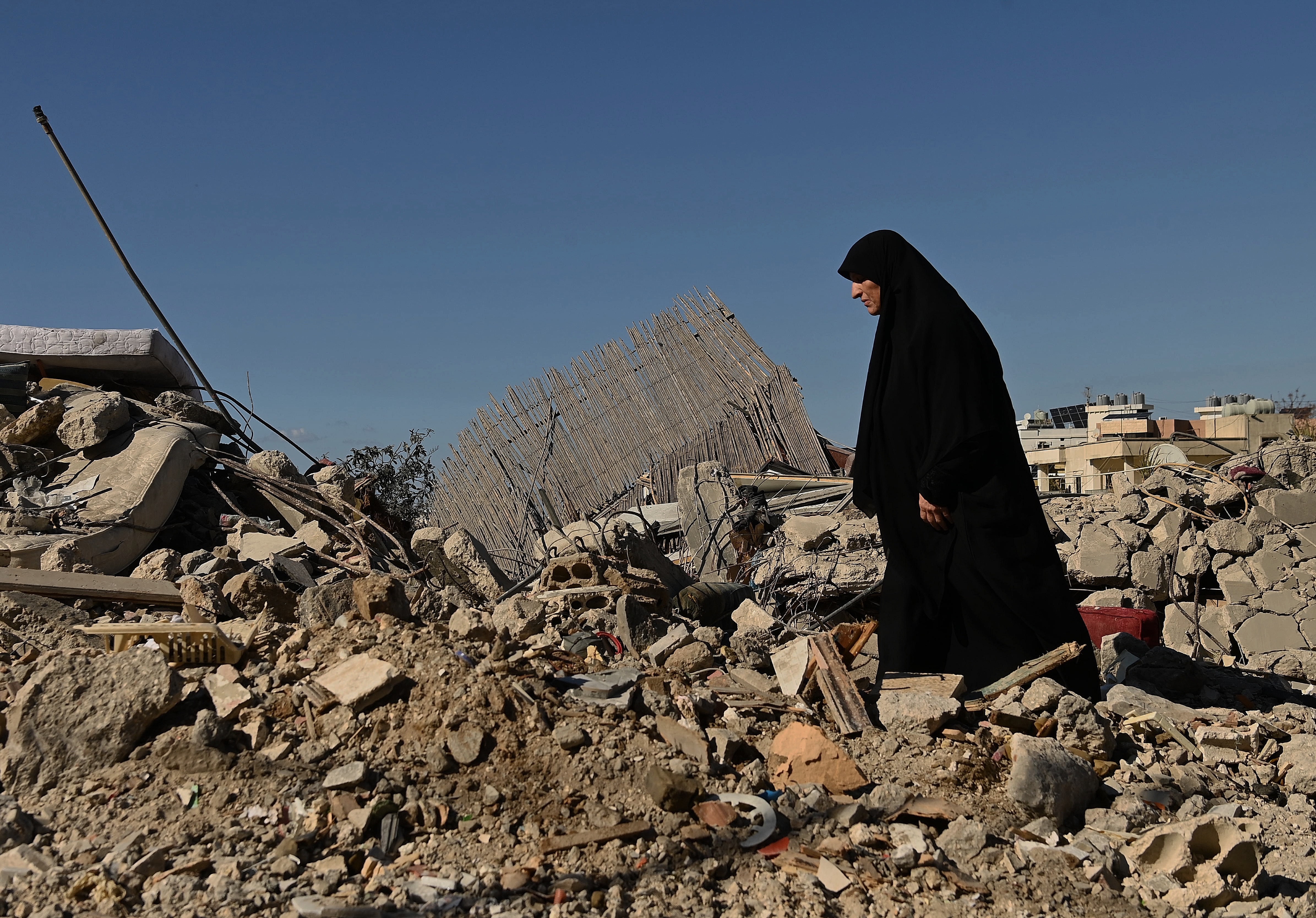 Um Qassem 55yrs at the bomb site where authorities are still searching for her nephew following an Israeli airstrike that targeted a residential building in Ghaziyeh on March 8, killing three people and injuring 5 people . March 9, 2026.