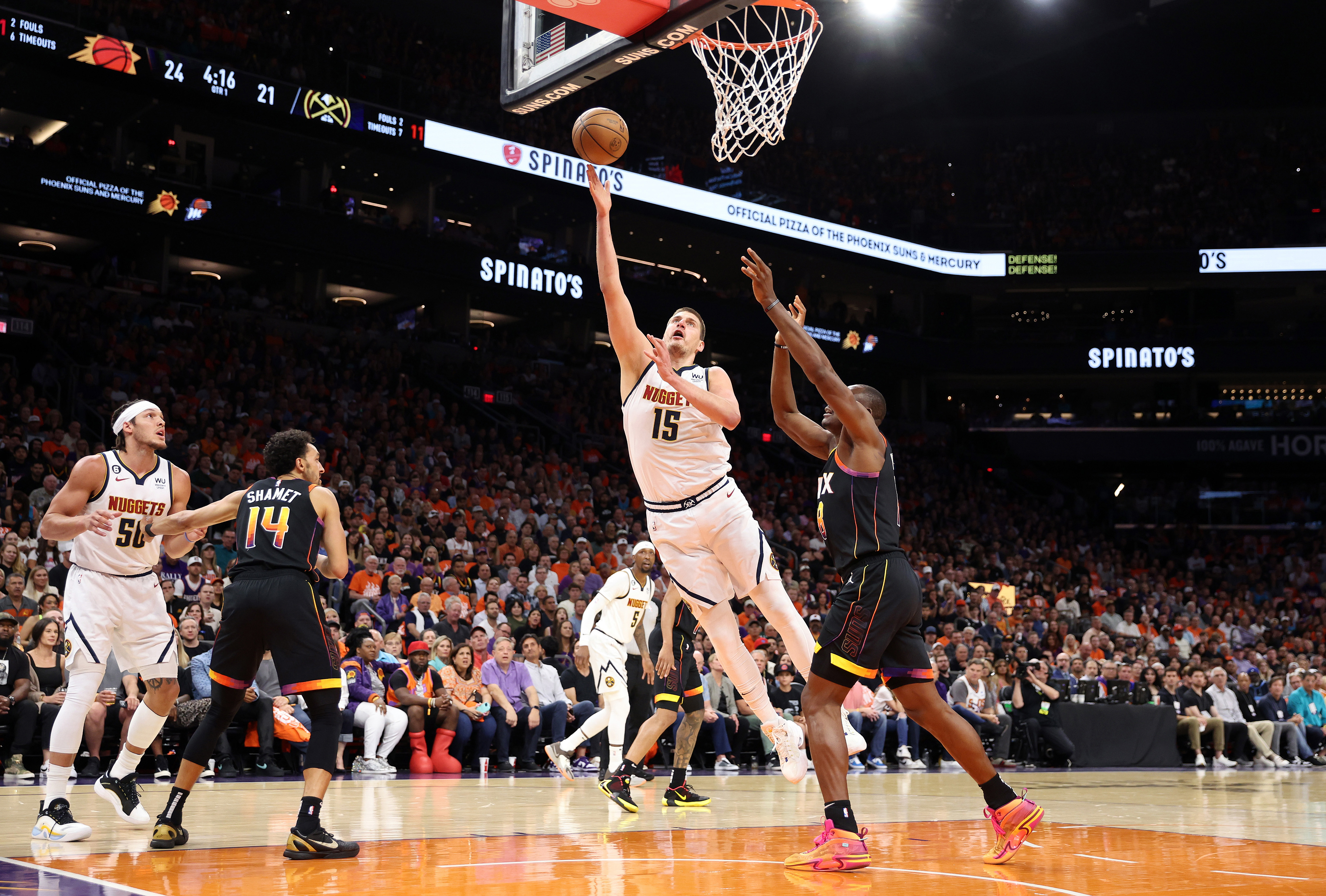 Denver Nuggets guard Kentavious Caldwell-Pope (5) shoots over Phoenix Suns  guard Cameron Payne (15) in the first half of Game 5 of an NBA basketball  semifinal playoff series Tuesday, May 9, 2023