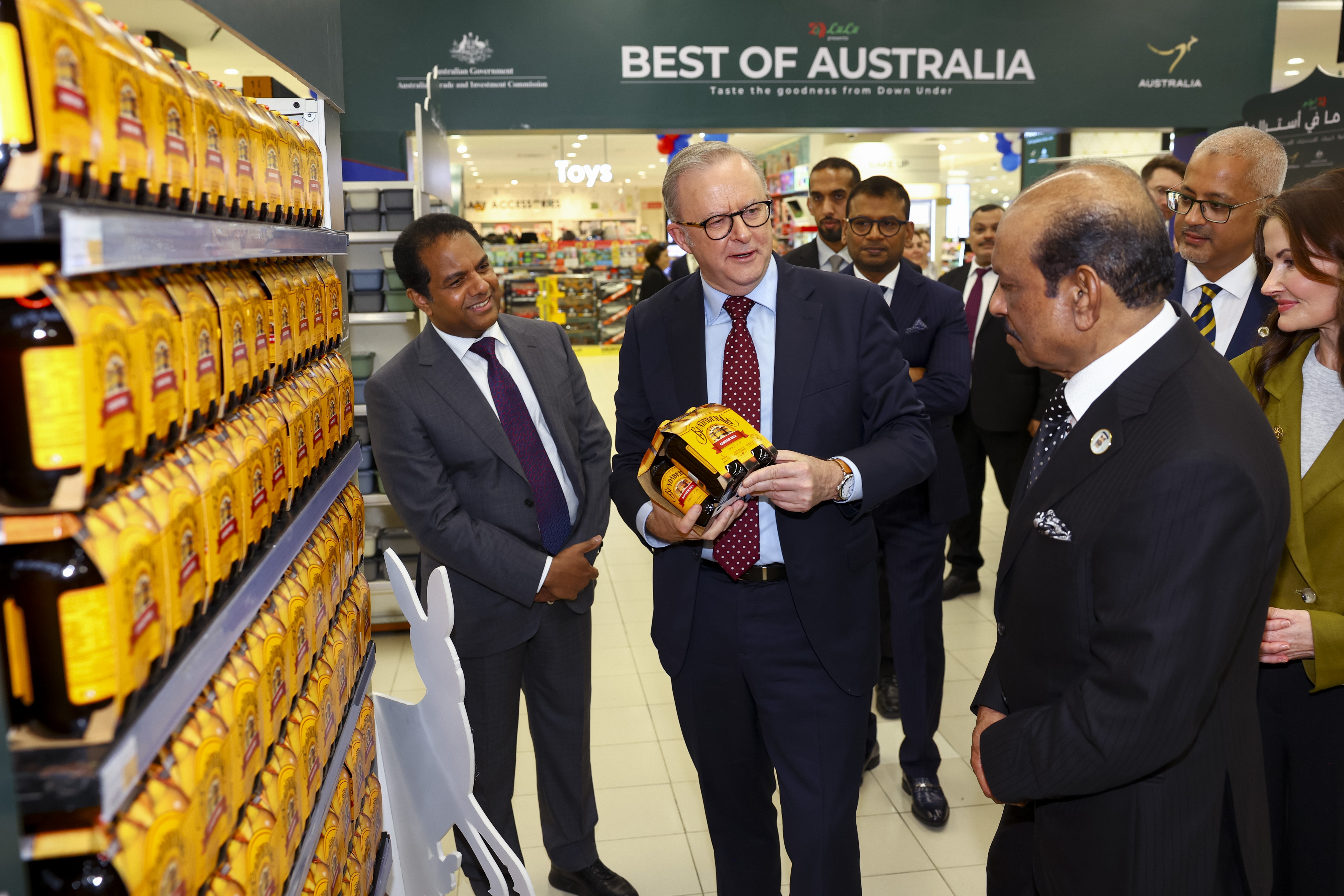 Prime Minister Anthony Albanese, with  Lulu Global Director, Global Operations & Chief Sustainability Officer Mohamed Althaf MM (left) and Lulu Chairman M. A. Yusuff Ali (right) during a visit to Lulu Hypermarket, which imports Australian goods to the UAE,  at Mushrif Mall in Abu Dhabi, United Arab Emirates on September 29, 2025.  