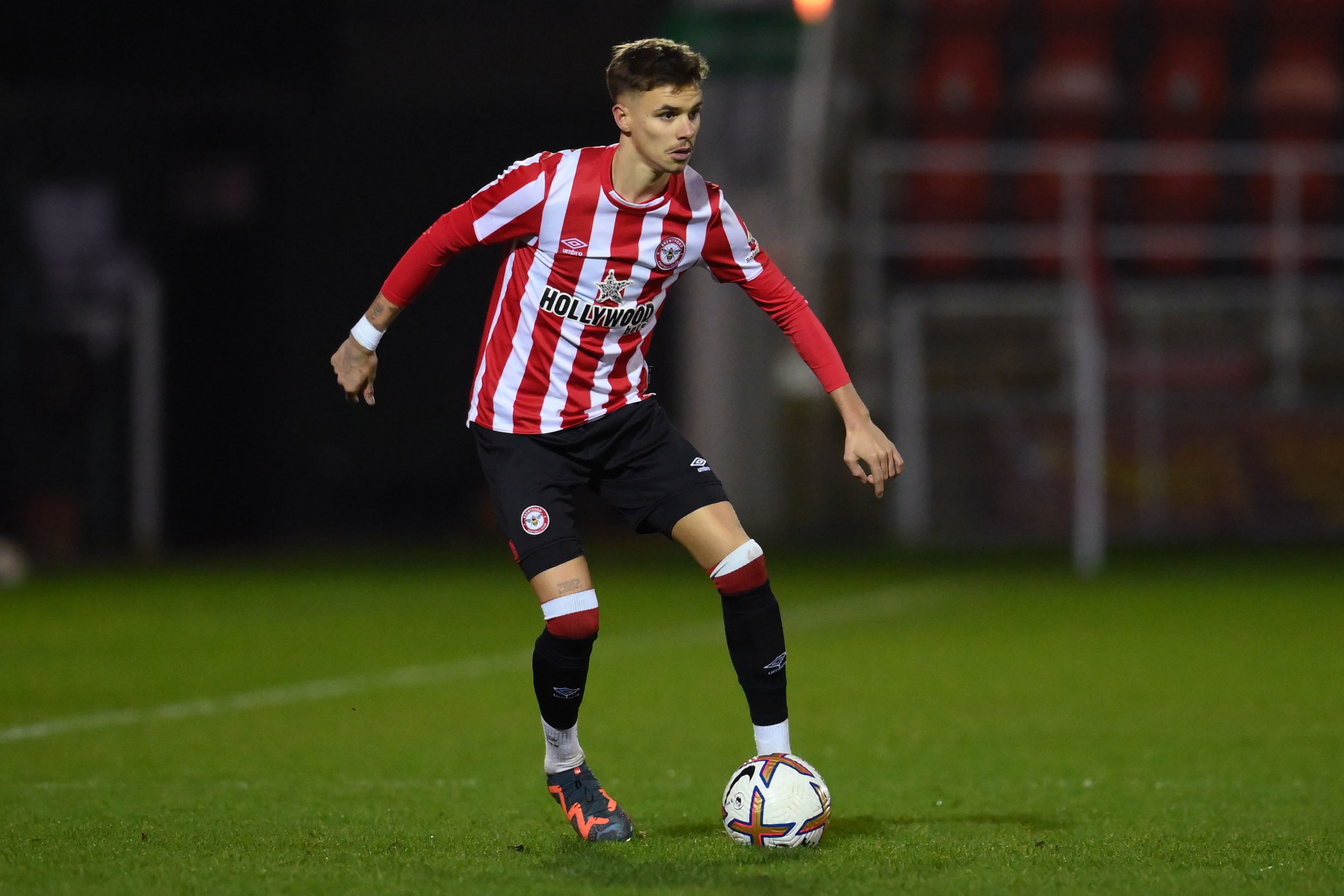 WOKING, ENGLAND - JANUARY 13: Romeo Beckham of Brentford B in action during the Premier League Cup match between Brentford B and Aston Villa U21 at The Laithwaite Community Stadium on January 13, 2023 in Woking, England. (Photo by Alex Broadway/Getty Images)
