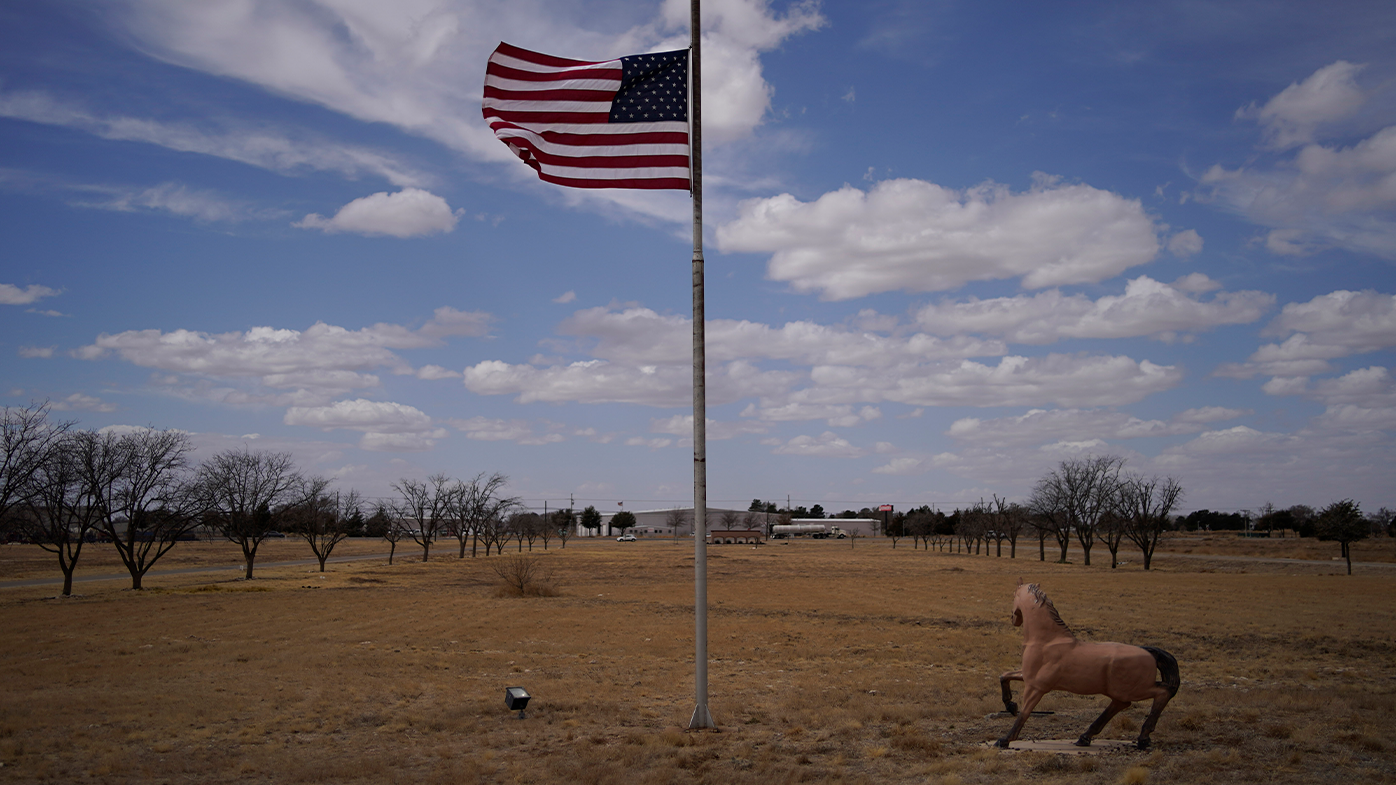 A flag flies at half staff at the University of the Southwest, Thursday, March 17, 2022, in Hobbs, New Mexico. 