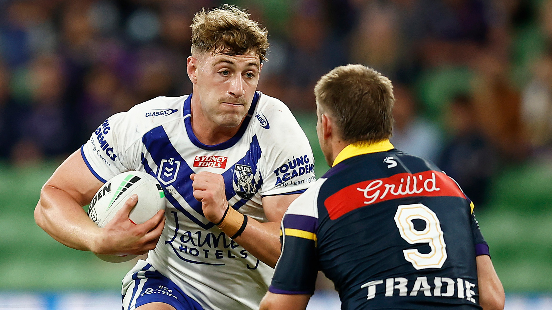 Max King of the Bulldogs runs at a Harry Grant of the Storm tackle during the round two NRL match between the Melbourne Storm and Canterbury Bulldogs at AAMI Park on March 11, 2023 in Melbourne, Australia. (Photo by Daniel Pockett/Getty Images)