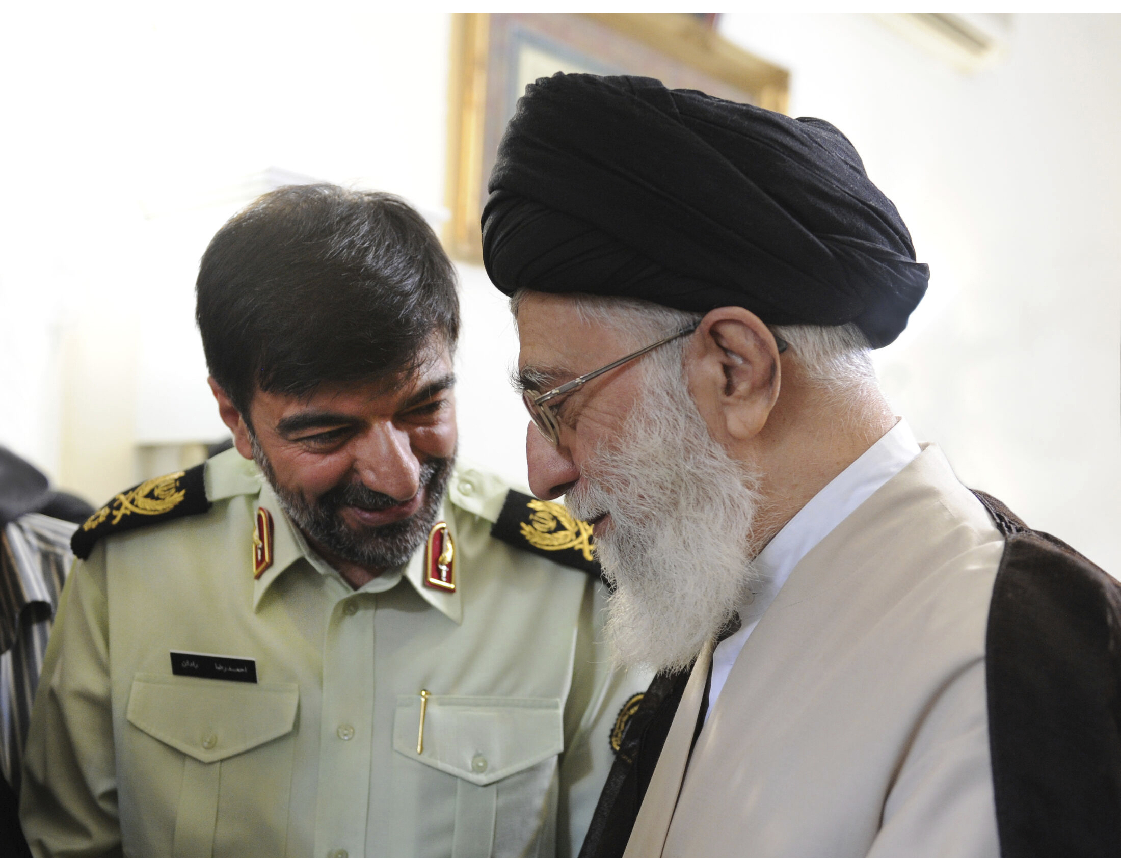 In this undated photo released on Saturday, Jan. 7, 2023, by the official website of the office of the Iranian supreme leader, Supreme Leader Ayatollah Ali Khamenei, right, speaks with Gen. Ahmad Reza Radan, Iran.