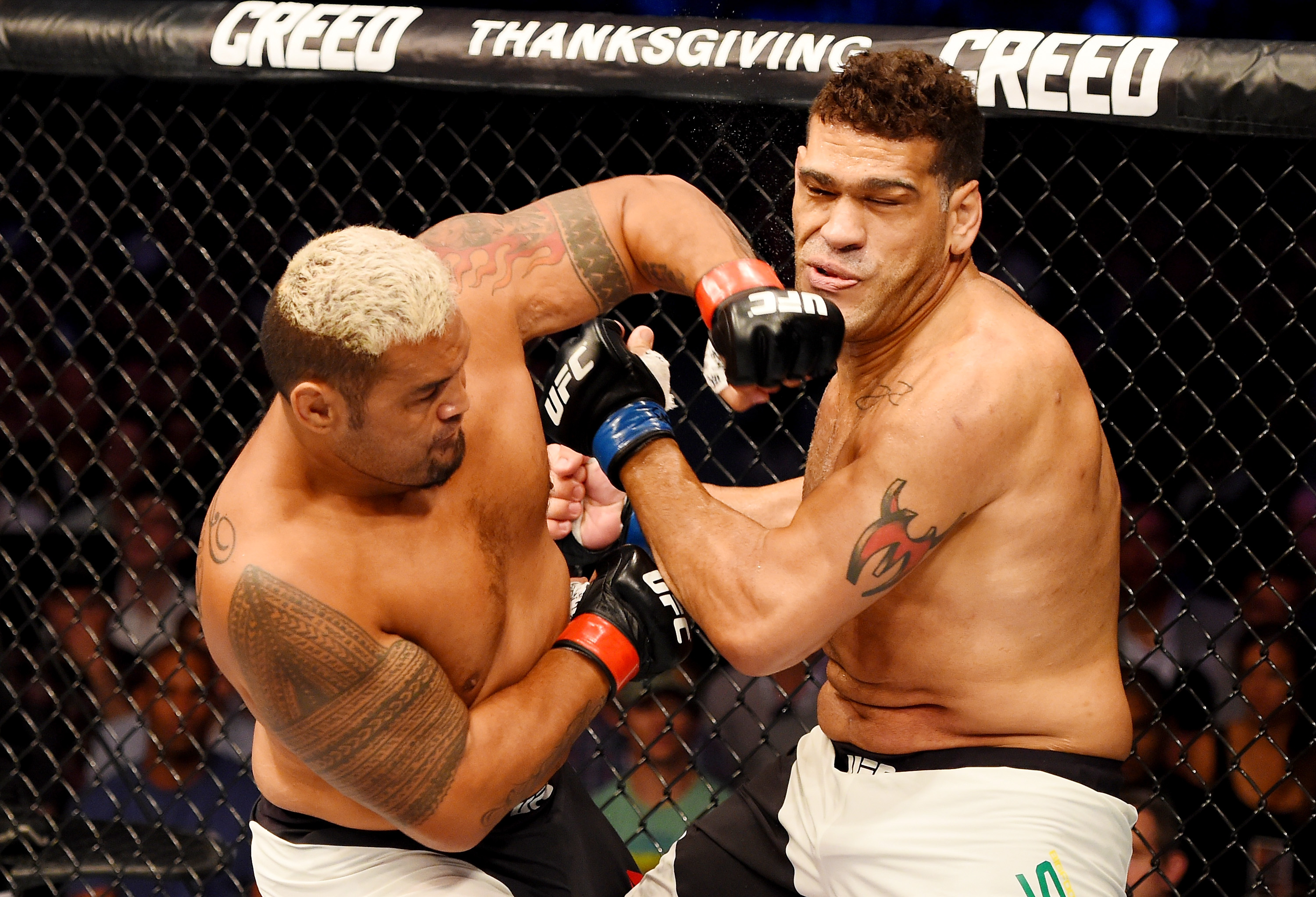 Mark Hunt punches Antonio Silva at Etihad Stadium in Melbourne.