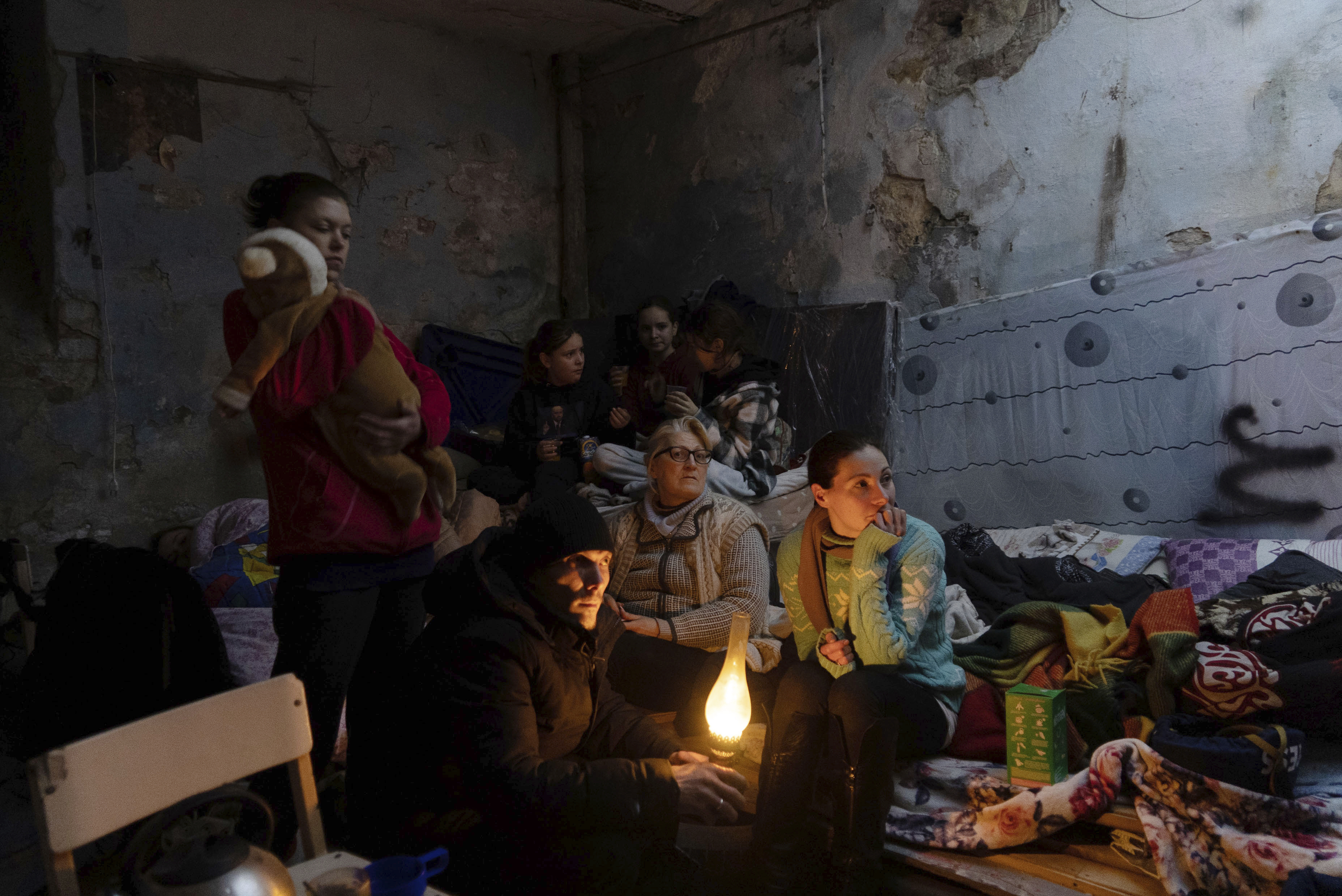 People settle in a bomb shelter in Mariupol, Ukraine, Sunday, March 6, 2022.