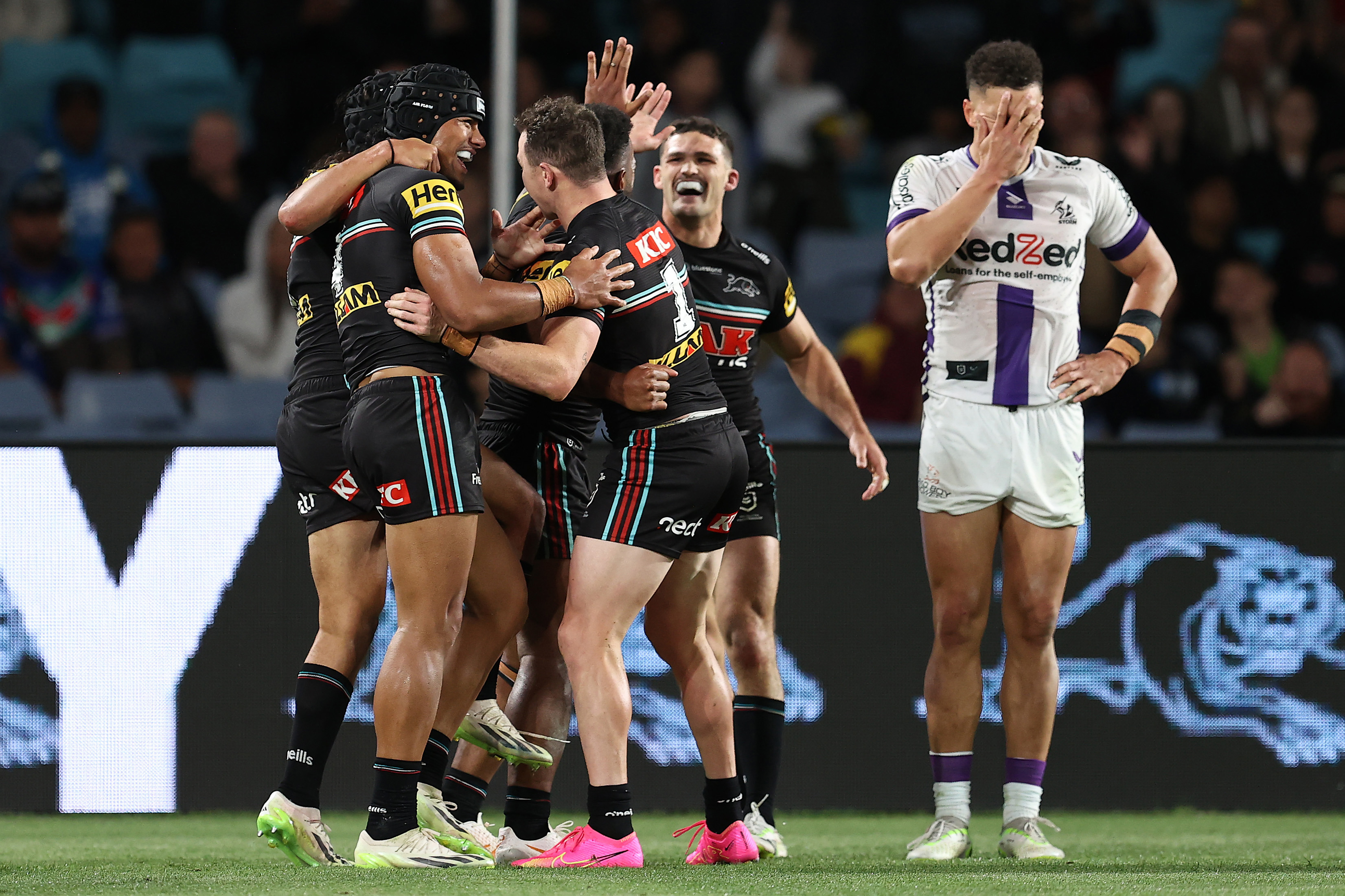 SYDNEY, AUSTRALIA - SEPTEMBER 22:  Dylan Edwards of the Panthers celebrates with team mates after scoring a try during the NRL Preliminary Final match between the Penrith Panthers and Melbourne Storm at Accor Stadium on September 22, 2023 in Sydney, Australia. (Photo by Brendon Thorne/Getty Images)