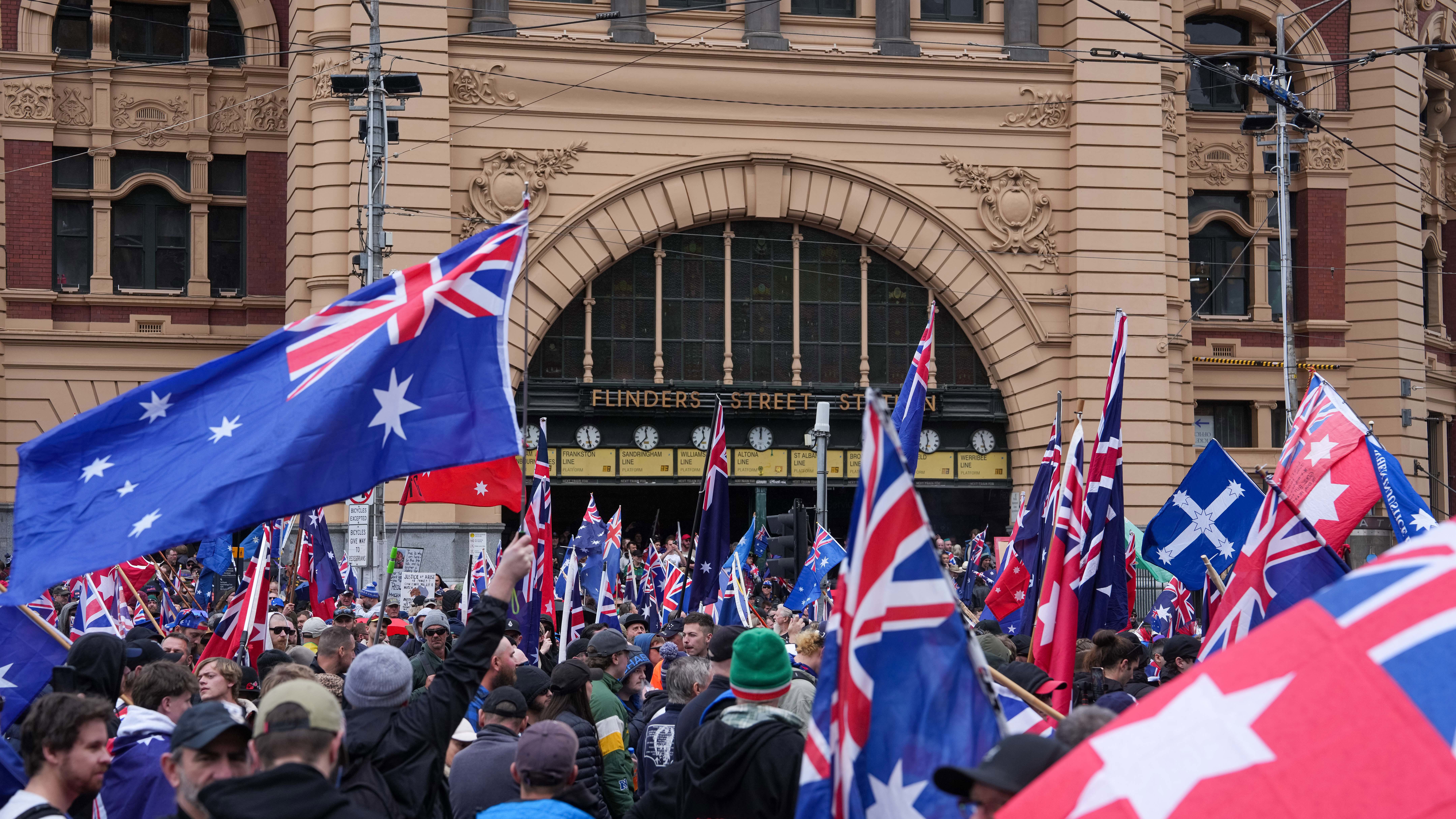 Anti-immigration protesters demonstrate outside Flinders Street Station in Melbourne.