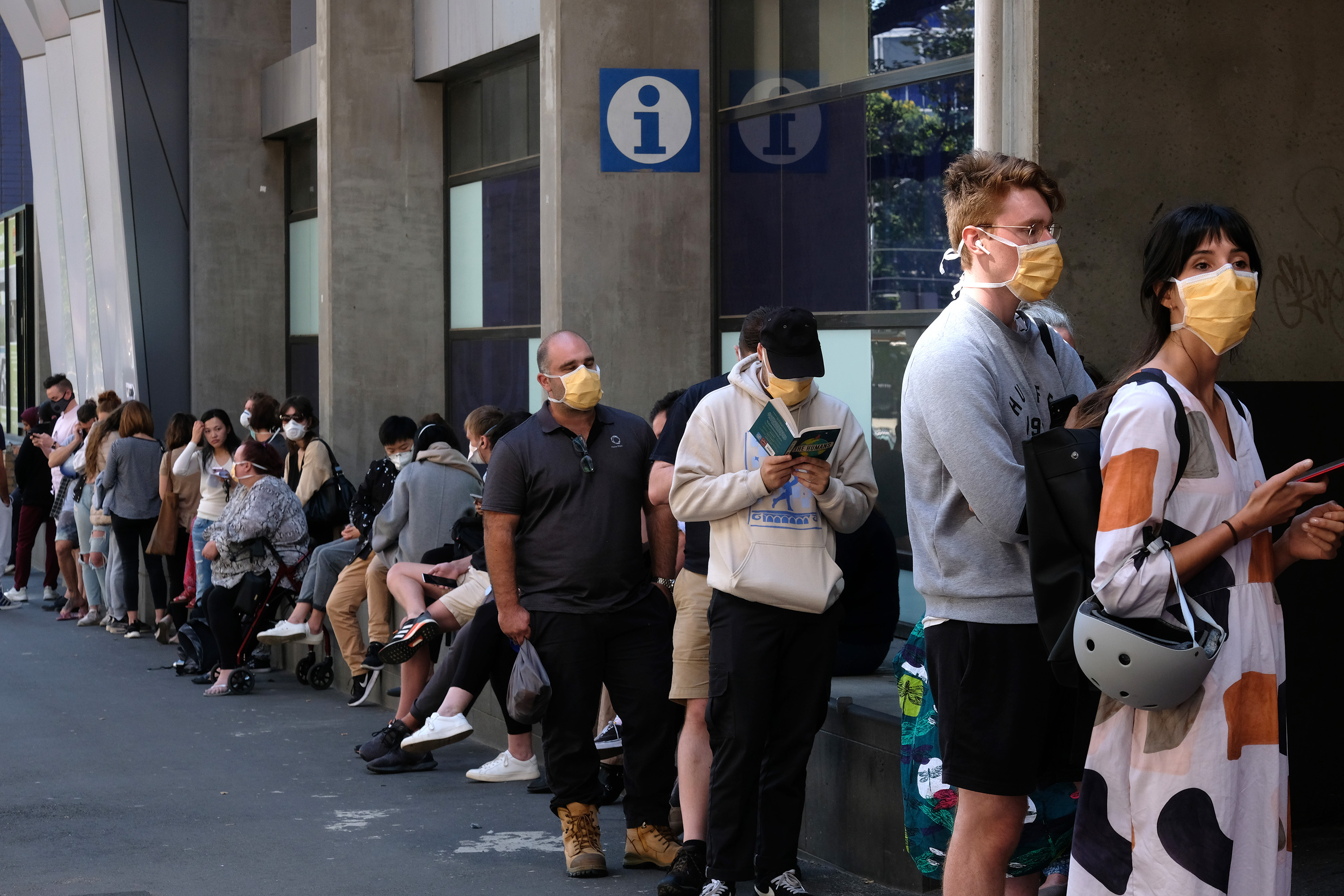 People are seen lining up to get tested for Coronavirus at the Royal Melbourne Hospital  on Tuesday 10 March 2020.  