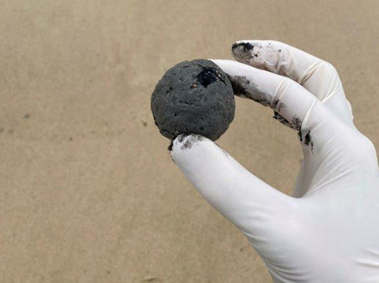 Mysterious ball-shaped debris has washed up on Sydney's popular Coogee Beach, forcing its closure until they are removed and tested. 