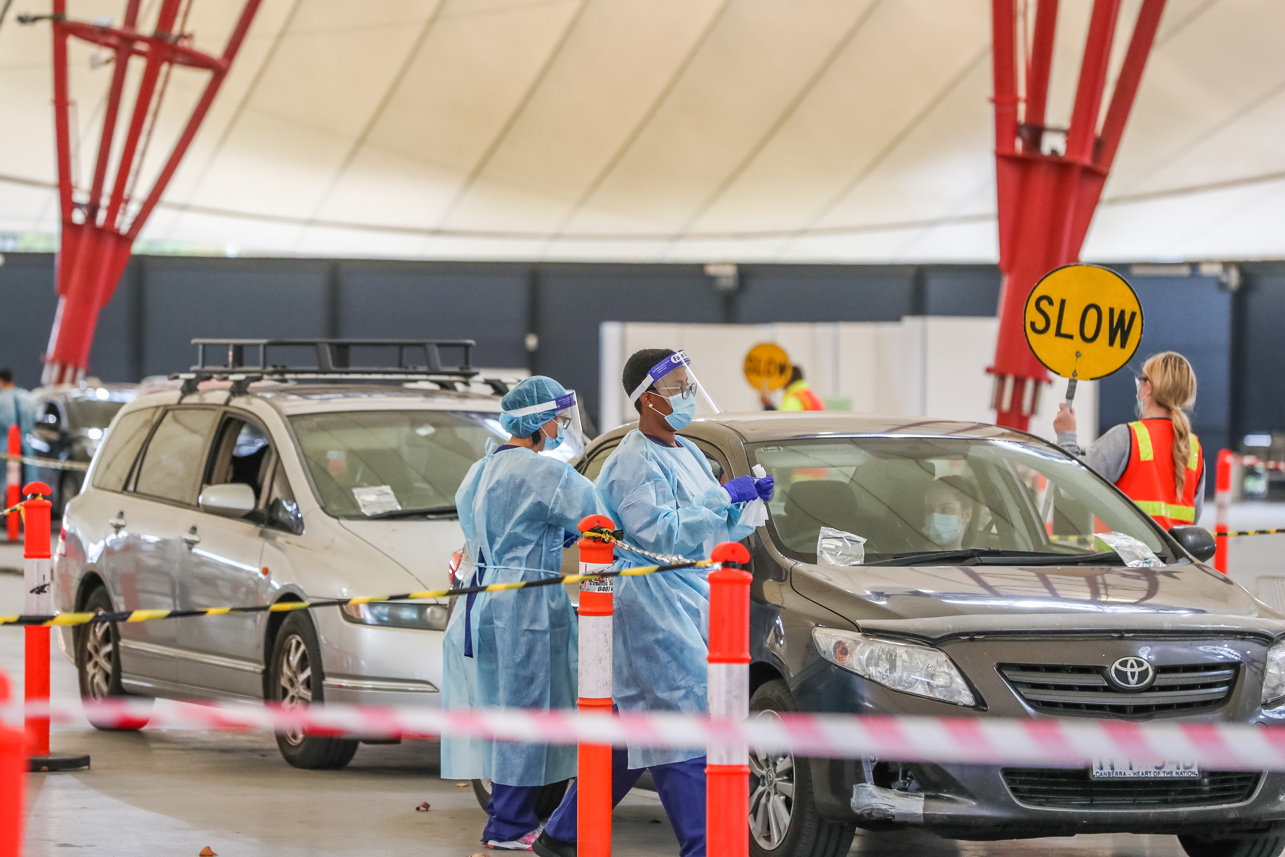 MELBOURNE, AUSTRALIA - MAY 25: A general view of a drive through COVID-19 testing facility at the Melbourne Showgrounds on May 25, 2021 in Melbourne, Australia. Victorian health authorities are investigating the source of a new community coronavirus cluster in Melbourne's north after four new COVID-19 cases were confirmed on Monday. The cases are all linked, being close family members across two households who are now in isolation. (Photo by Asanka Ratnayake/Getty Images)