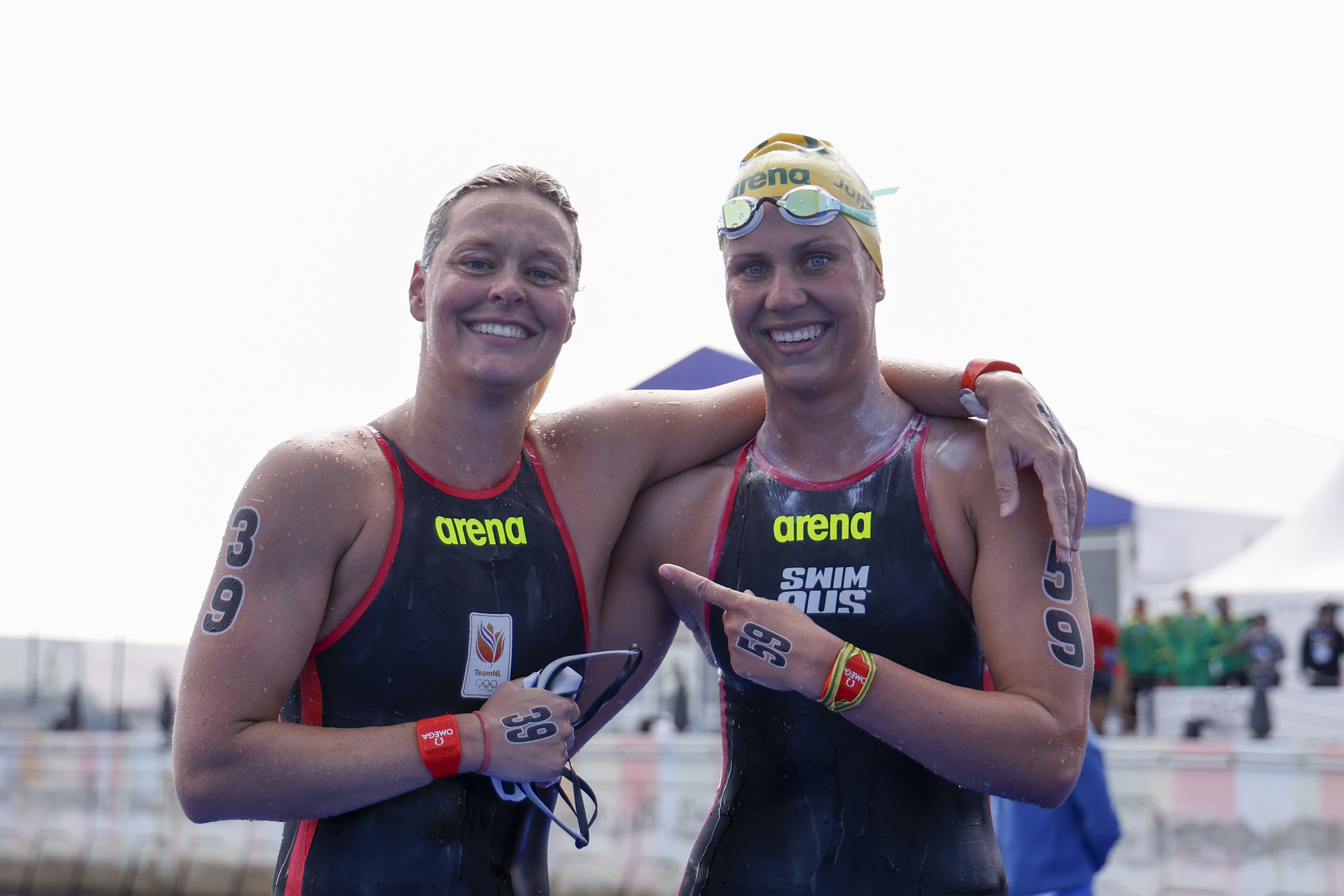 Sharon van Rouwendaal of the Netherlands and Moesha Johnson of Australia celebrate after the 10km World Aquatics Championships event.