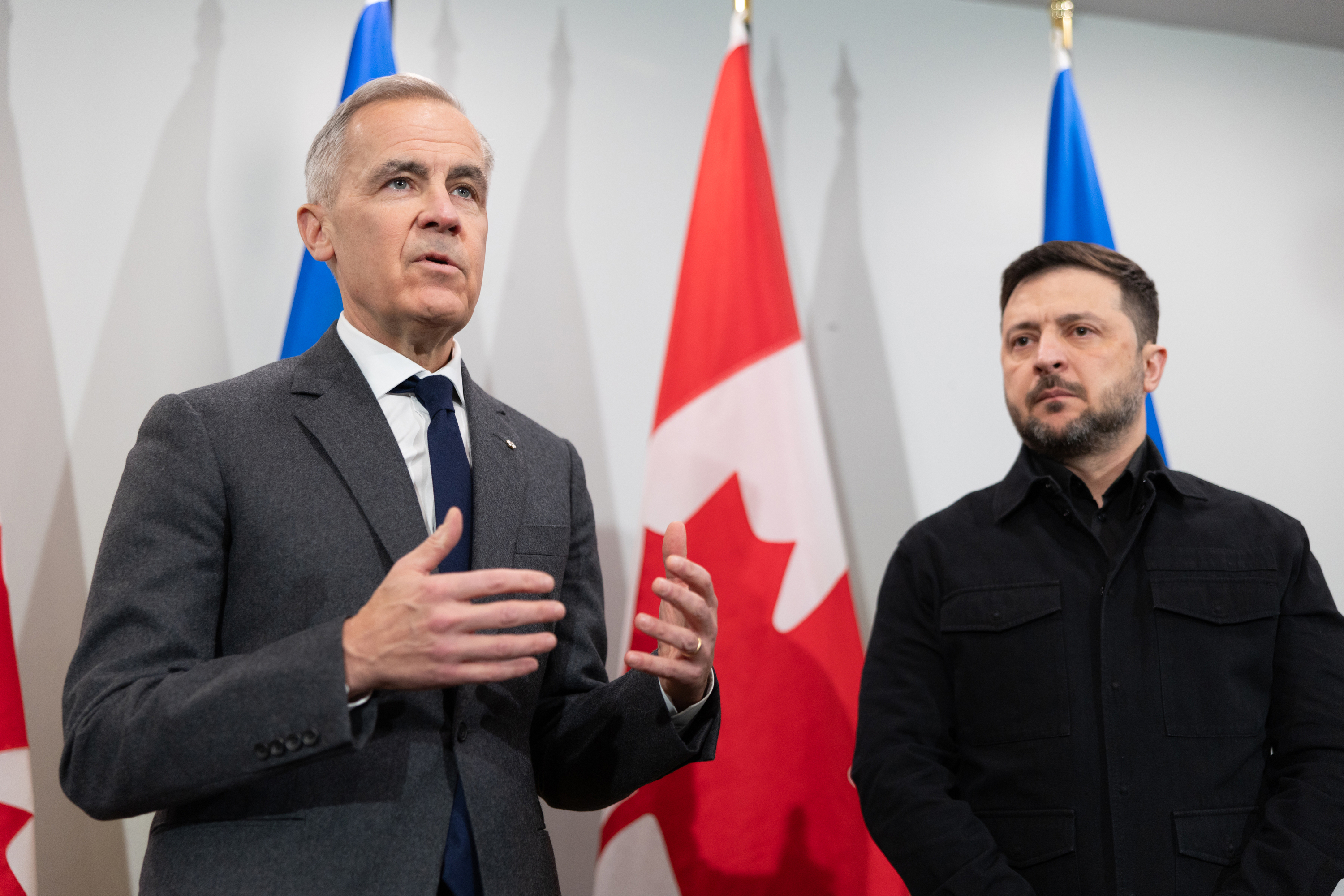 Prime Minister Mark Carney, left, and Ukrainian President Volodymyr Zelenskyy hold a news conference in Halifax, N.S. on Saturday, Dec. 27, 2025.(Riley Smith /The Canadian Press via AP)