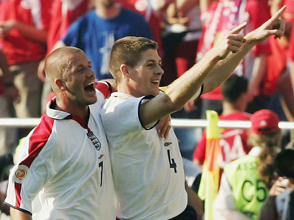 Steven Gerrard of England celebrates with David Beckham (L) after he scores their third goal during the UEFA Euro 2004 Group B match between England and Switzerland.
