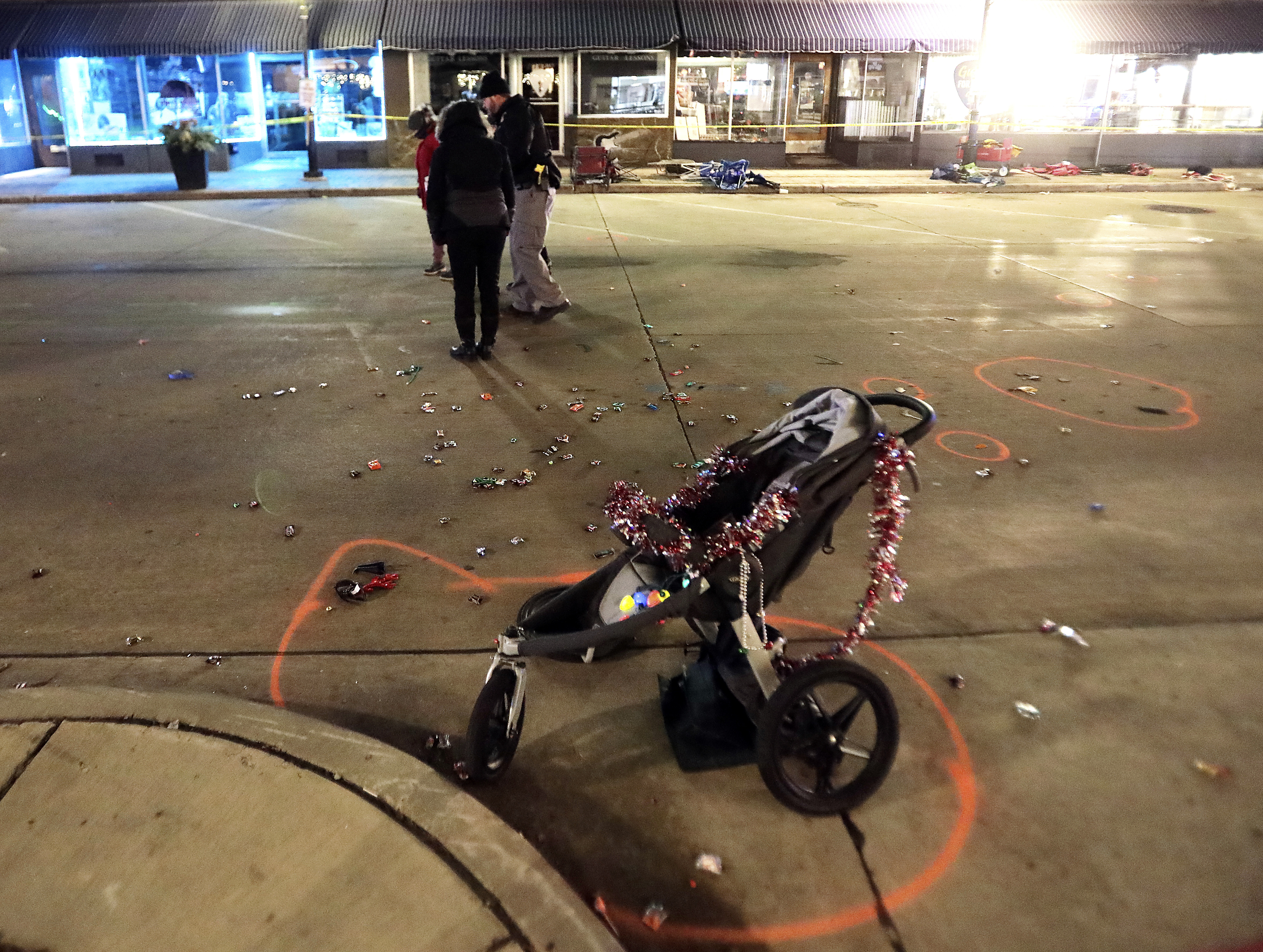 A broken childrens stroller lies in W. Main St. in downtown Waukesha after an SUV drove into Christmas parade-goers. 