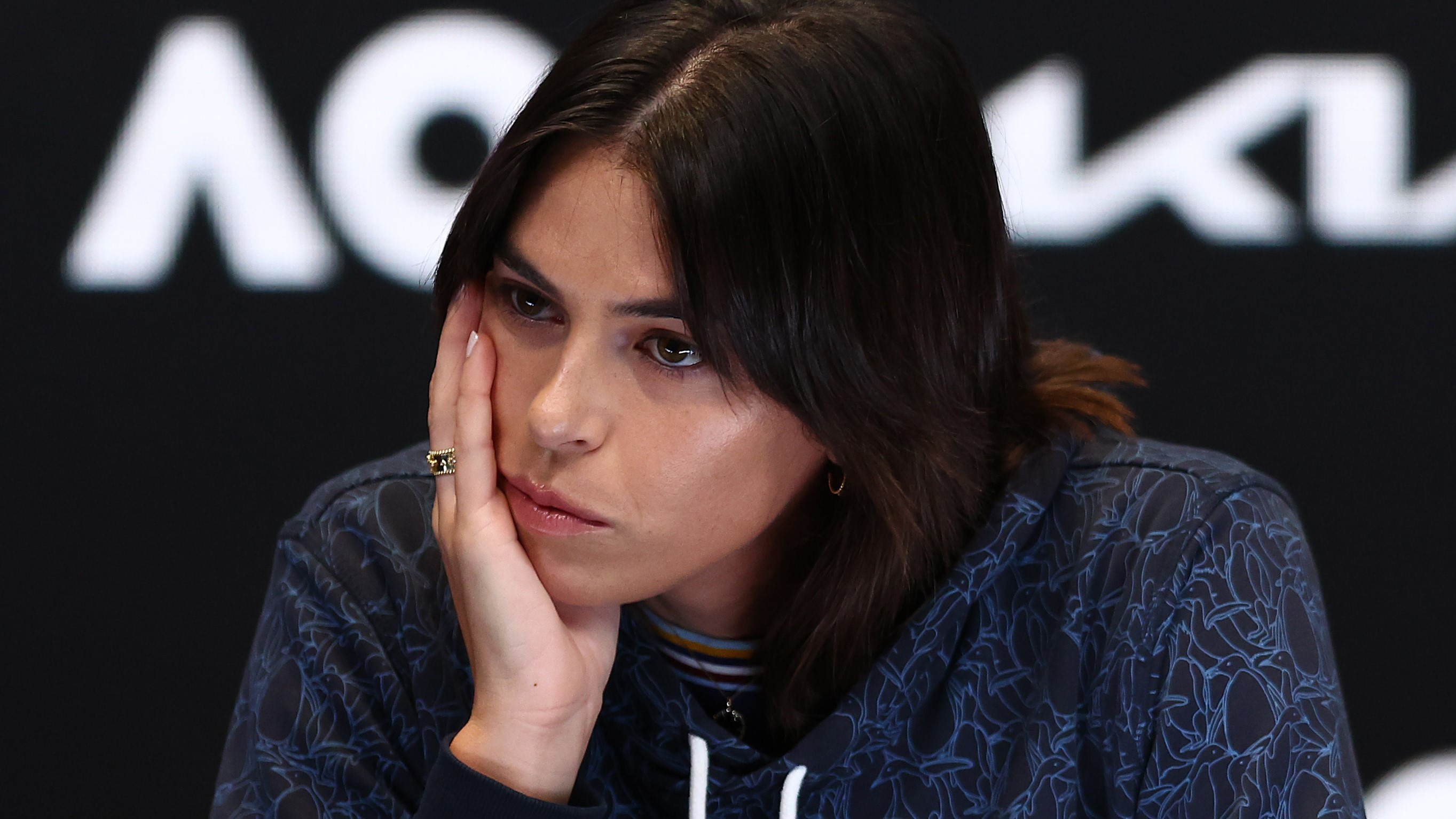 A teary Ajla Tomljanovic speaks to the media during a press conference after pulling out of the 2023 Australian Open.