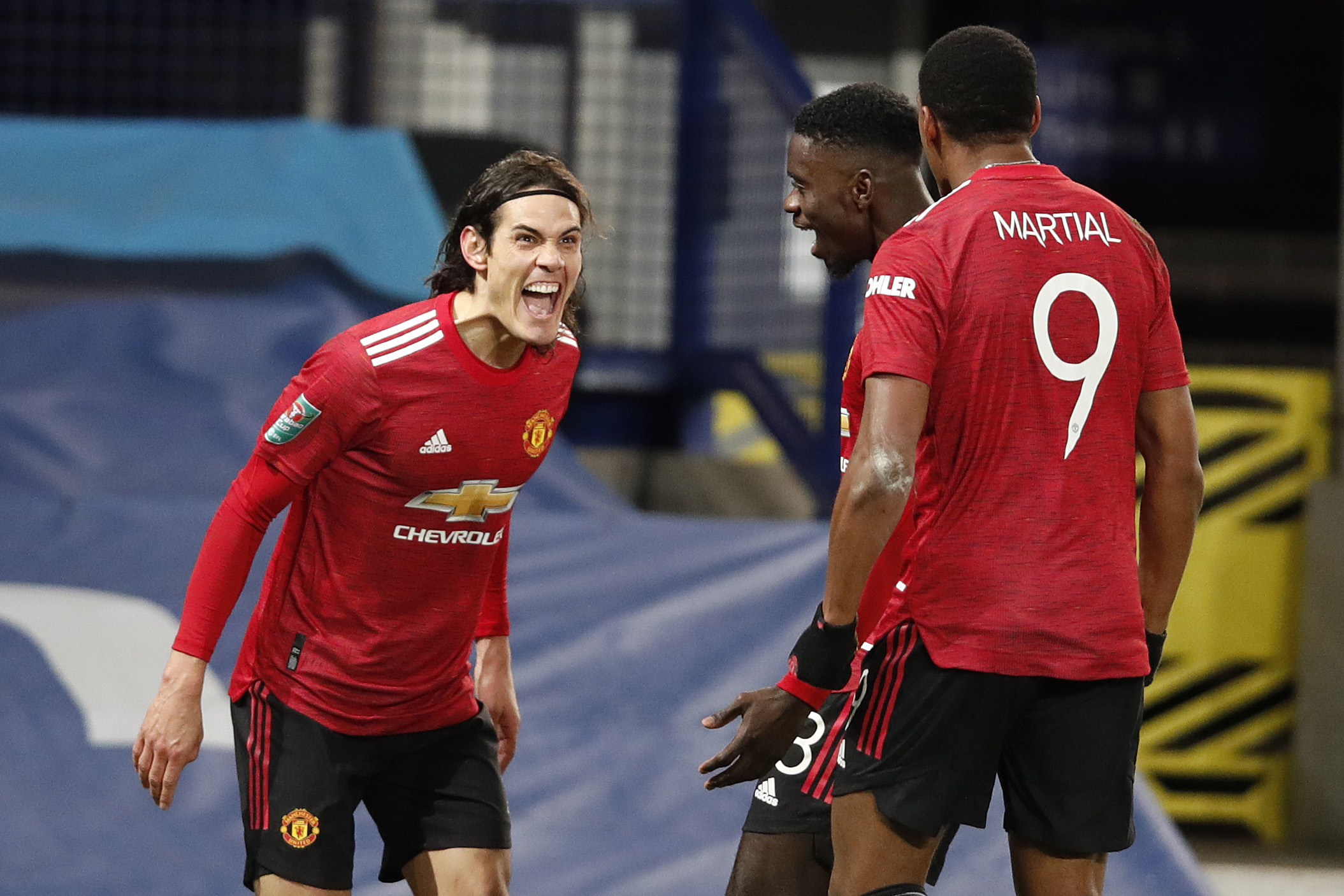 Edinson Cavani of Manchester United celebrates with Axel Tuanzebe and Anthony Martial.