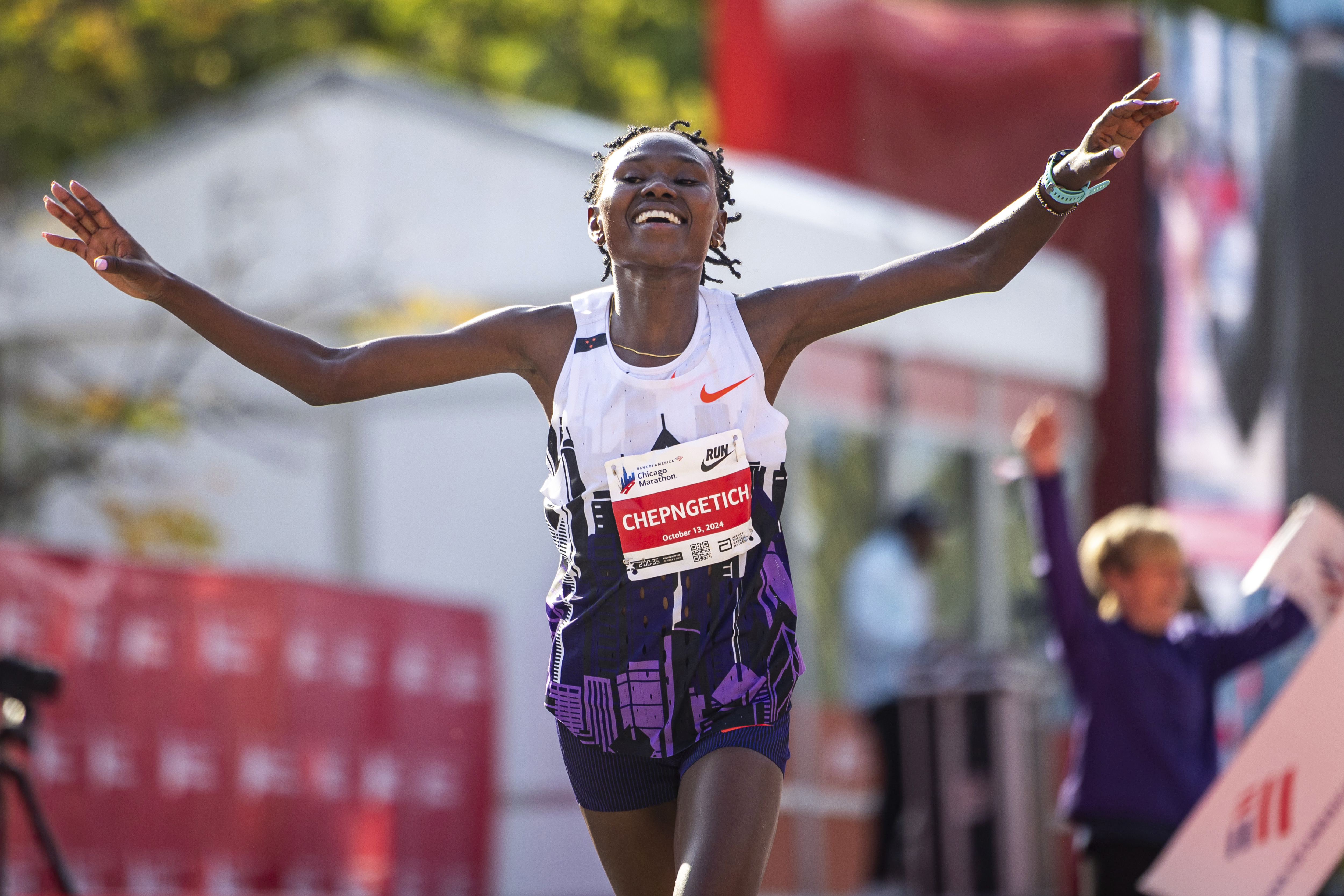 Ruth Chepngetich of Kenya crosses the finish line of the Chicago Marathon to win in world record time.