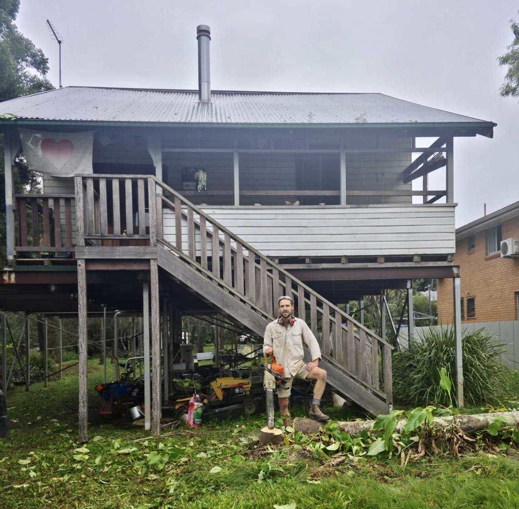 Hamish Webster, pictured outside his home when it was in Lismore.