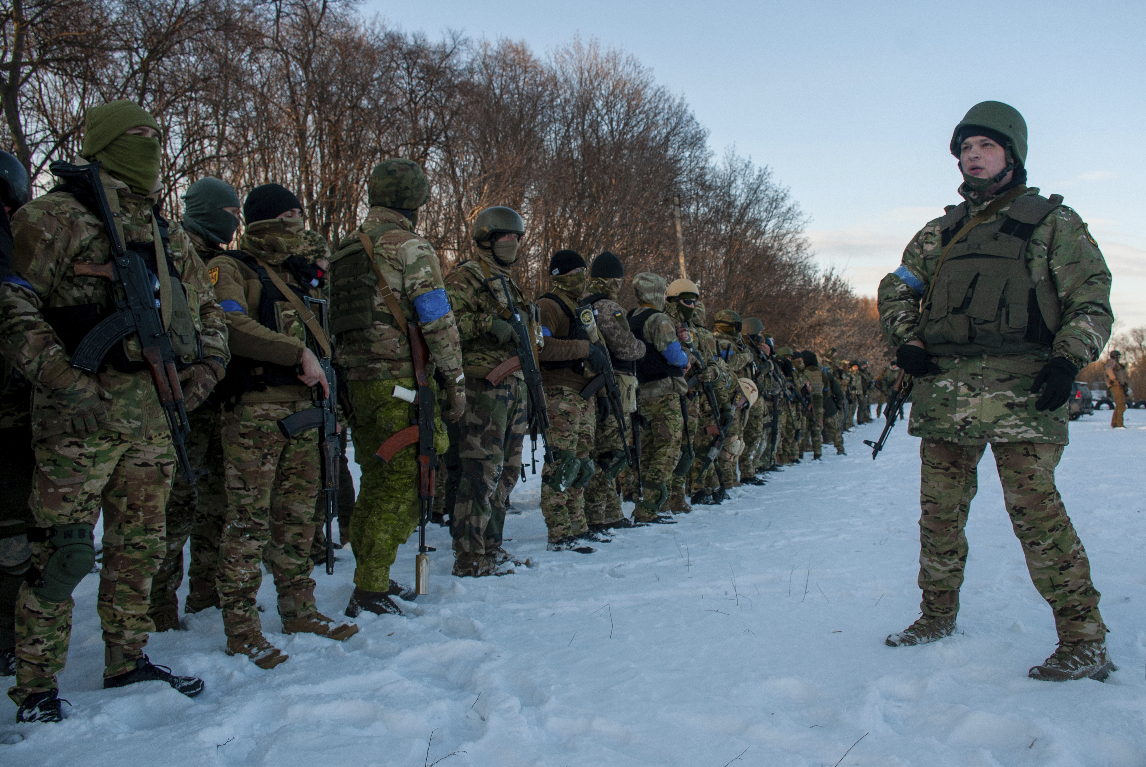 Ukrainian servicemen attend a training session outside Kharkiv, Ukraine, Friday, March 11, 2022.