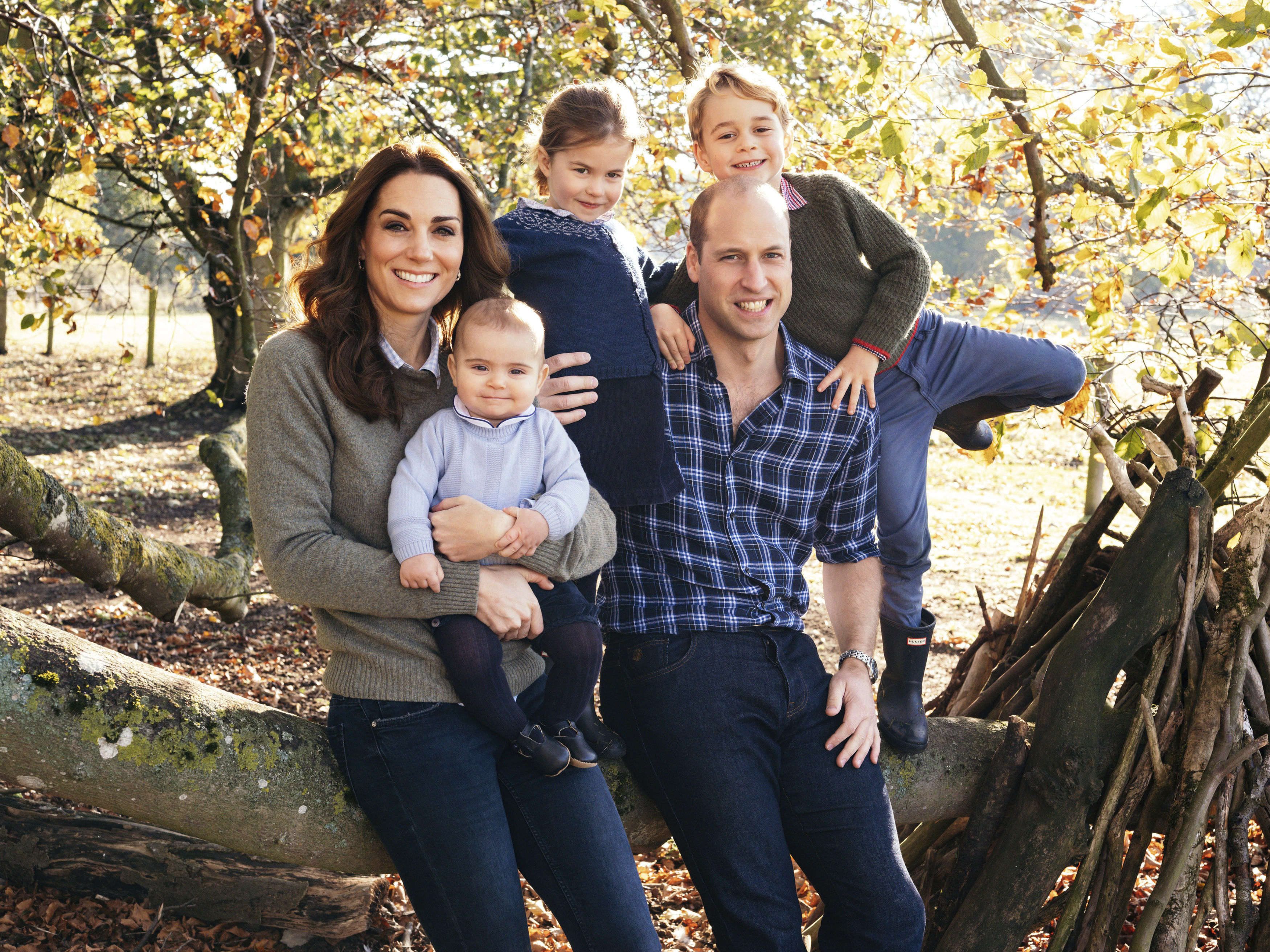 This photo released by Kensington Palace on Friday Dec. 14, 2018, shows the photo taken by Matt Porteous of Prince William and Kate, Duchess of Cambridge with their children Prince George, right, Princess Charlotte, center, and Prince Louis at Anmer Hall in Norfolk, east England, which is to be used as their 2018 Christmas card. (Matt Porteous/Kensington Palace via AP)