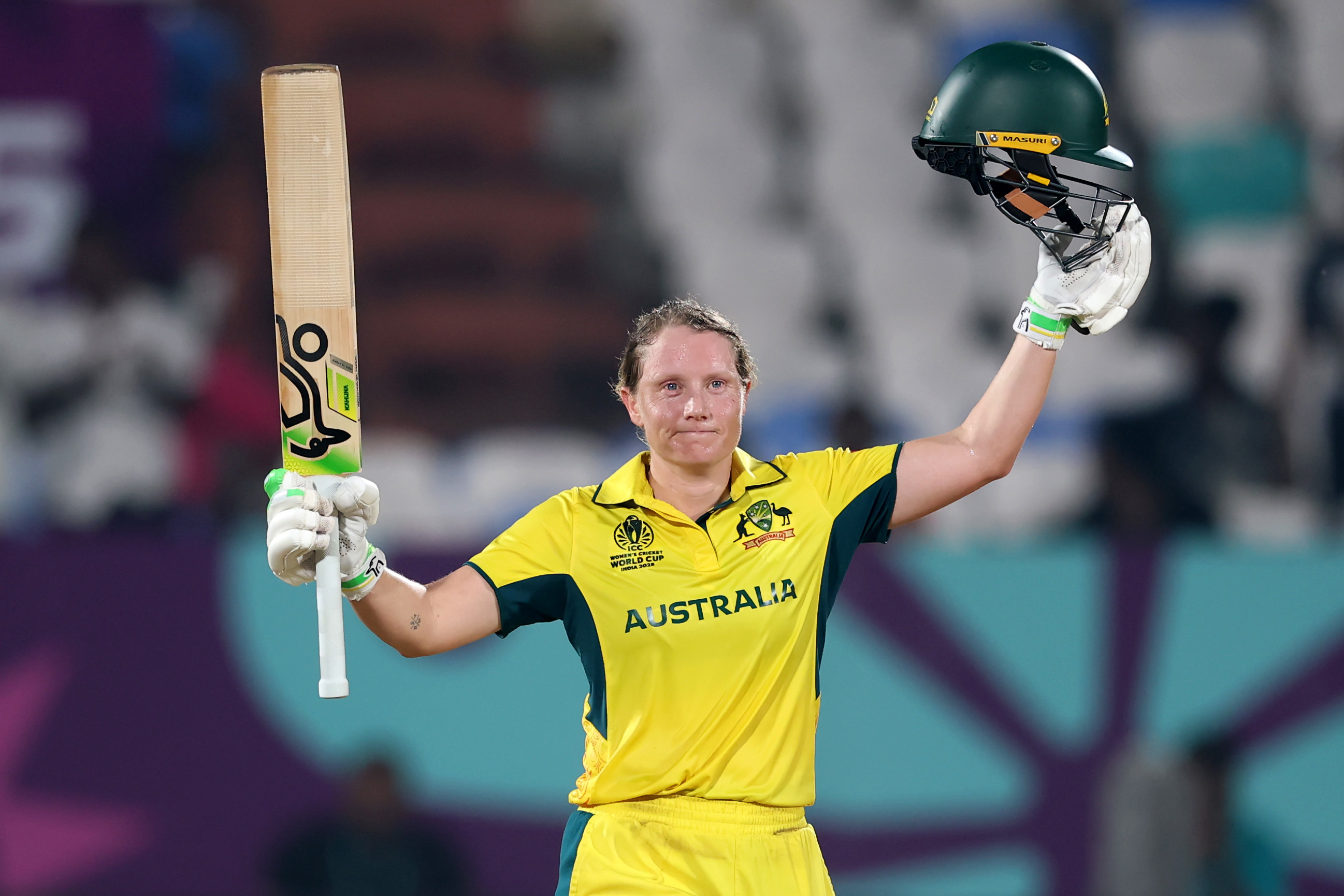 Australia captain Alyssa Healy celebrates hercentury that helped power Australia past Bangladesh at the ICC Women's Cricket World Cup.
