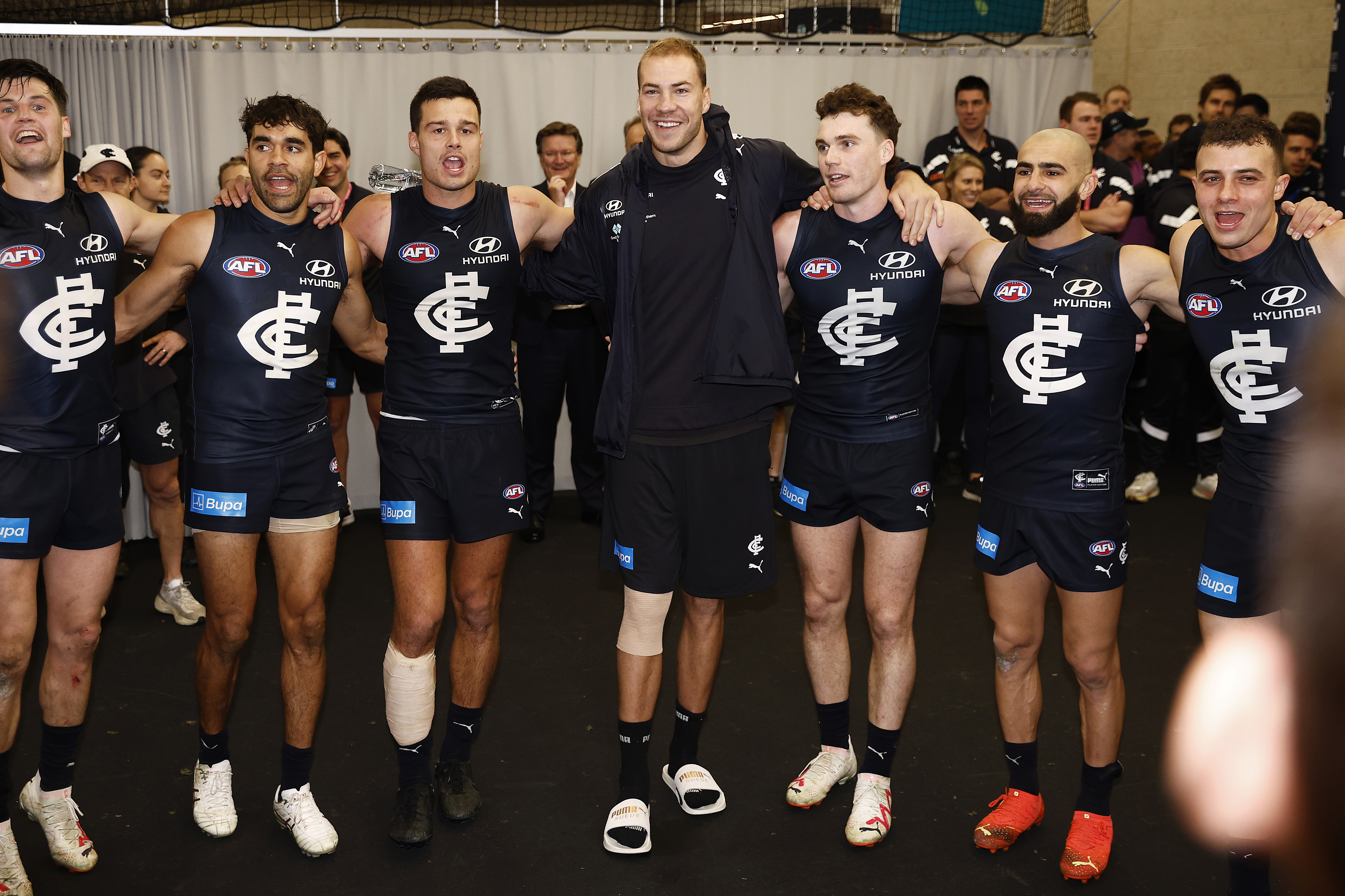 MELBOURNE, AUSTRALIA - JULY 15: Harry McKay of the Blues (C) and teammates sing the team song after winning the round 18 AFL match between Carlton Blues and Port Adelaide Power at Marvel Stadium, on July 15, 2023, in Melbourne, Australia. (Photo by Daniel Pockett/Getty Images)