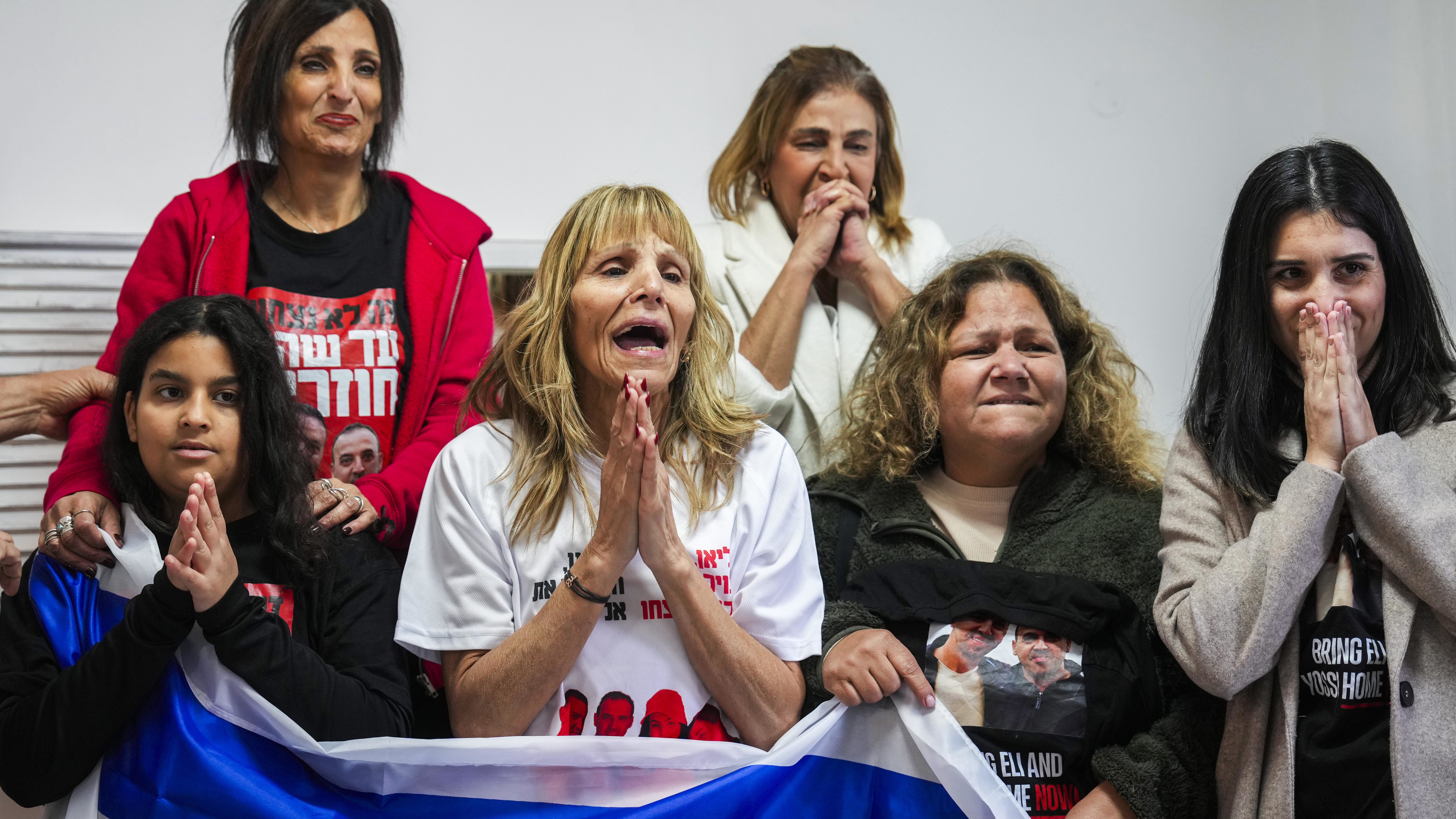 Family of Israeli hostage Eli Sharabi, whose wife and two daughters were killed on Oct. 7 attack, react as they wait the live broadcast of him being released from Hamas captivity in Gaza, in Tel Aviv, Israel.