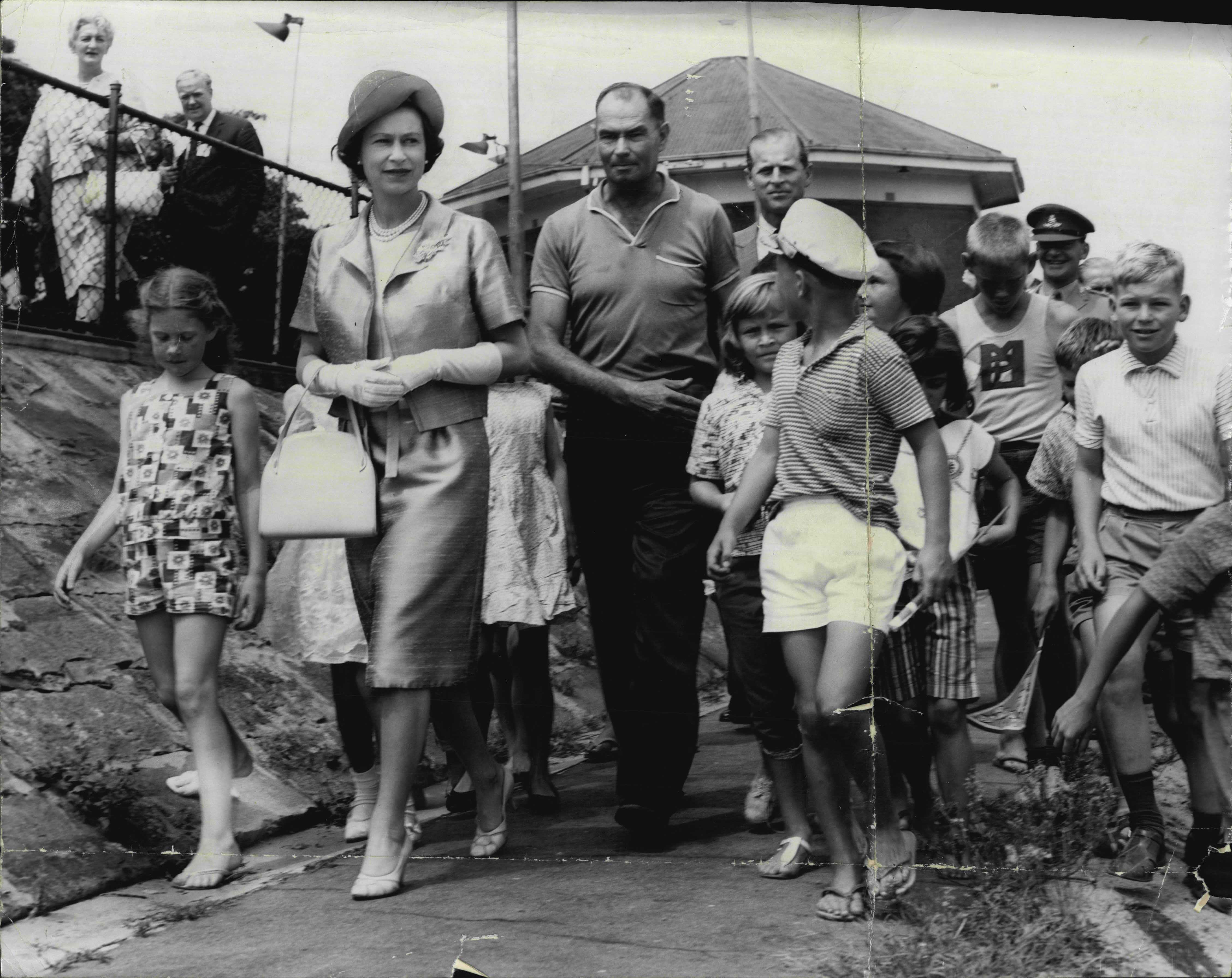 Queen Elizabeth and the Duke Of Edinburgh meeting with local children in Canberra during their 1963 tour.