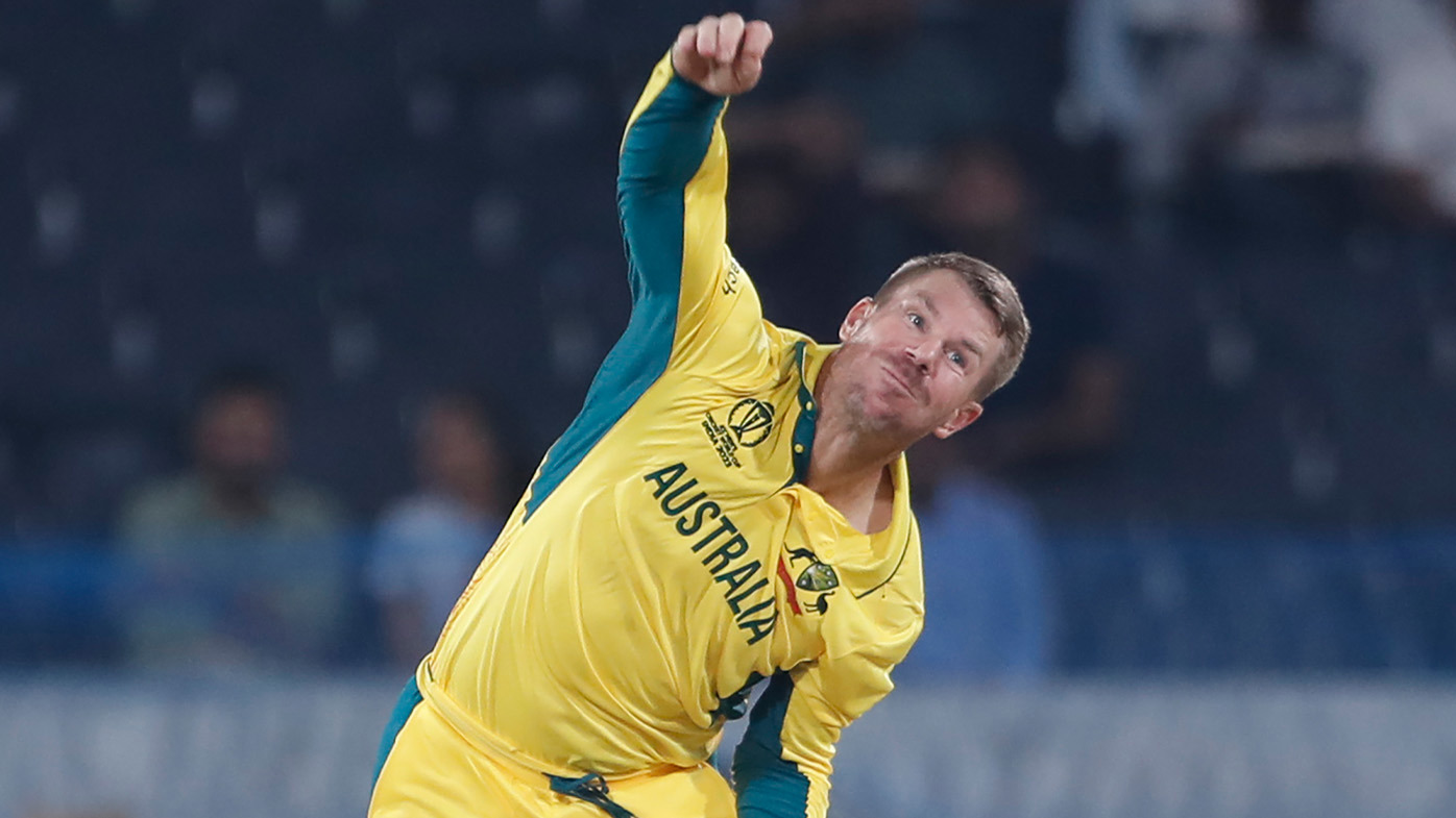David Warner rolling the arm over in Australia's warm-up match against Pakistan.