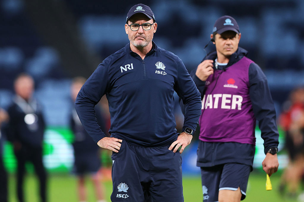 Waratahs coach Dan McKellar watches on.