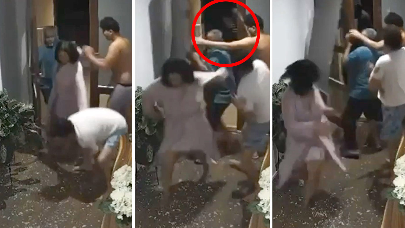 Chilling footage shows family retaliating as masked thugs try to break into home 