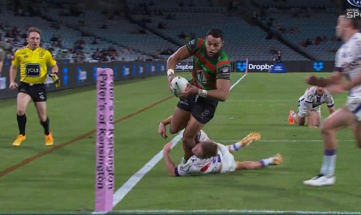 Melbourne hooker Harry Grant stops Rabbitohs winger Izaac Thompson scoring a try.