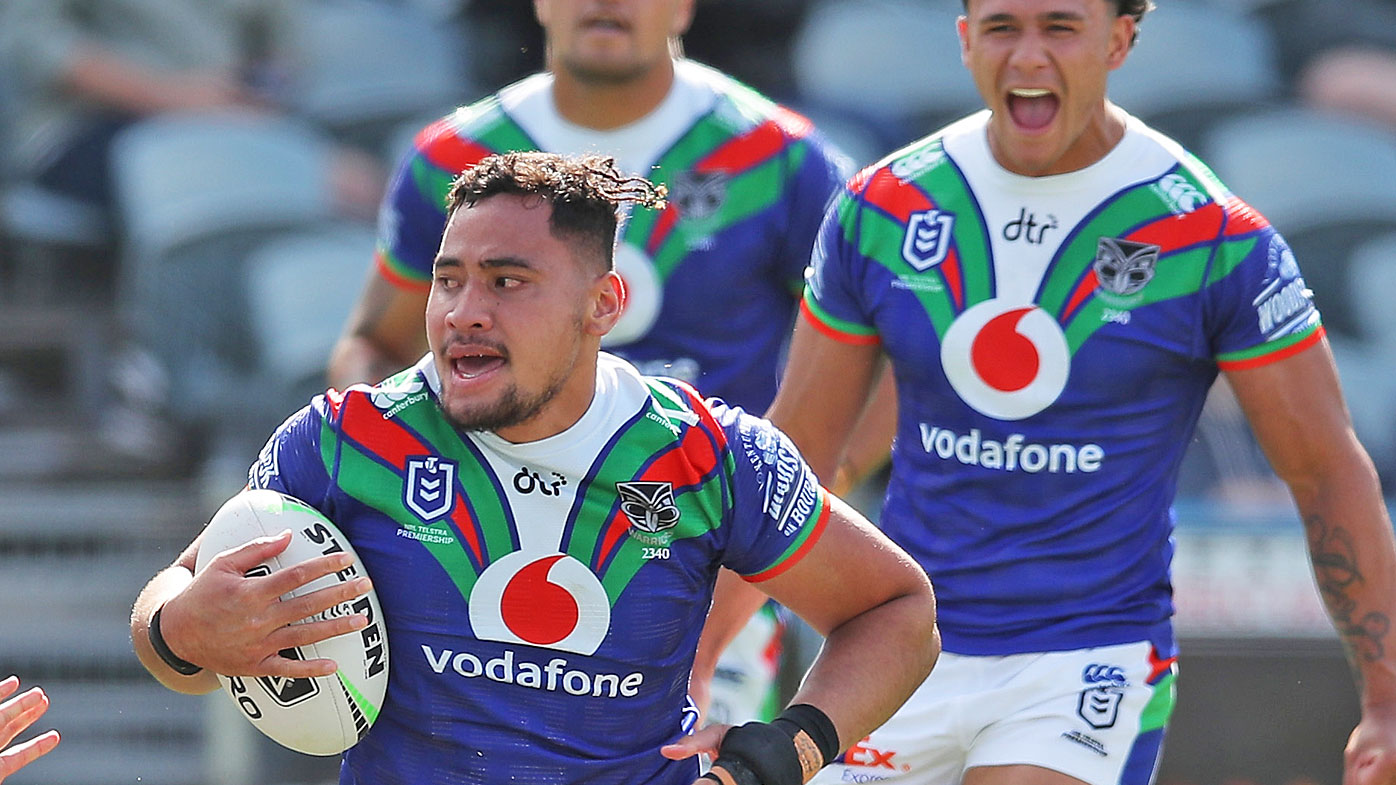 Eliesa Katoa of the Warriors celebrates scoring a try