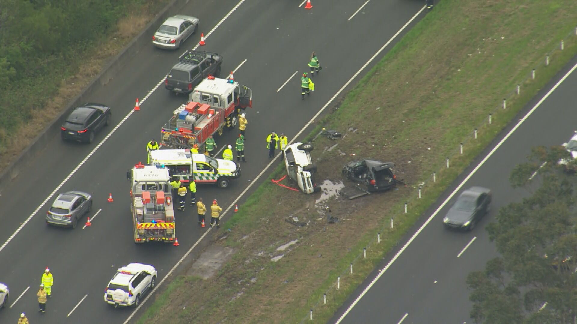 A father and son have been killed in a "very traumatic" highway crash this morning on the NSW Central Coast.