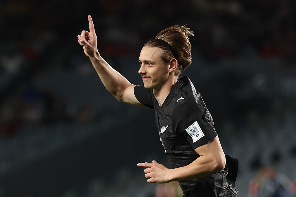 Ben Waine of New Zealand celebrates scoring his team's fourth goal.