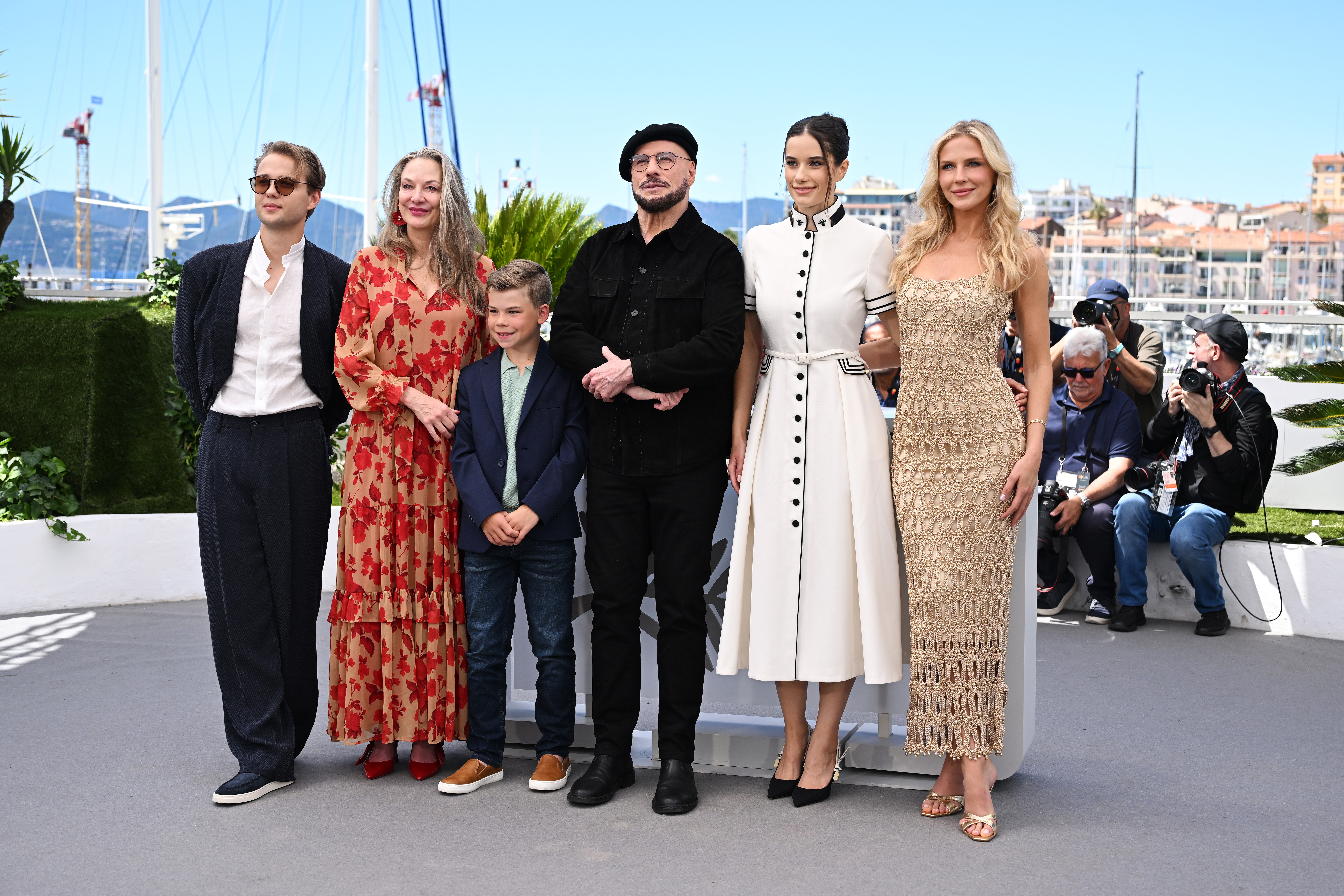 (L-R) Edouard Philipponnat, Kelly B. Eviston, Clark Shotwell, John Travolta, Ella Bleu Travolta and Olga Hoffmann attend the Official Cannes Film Festival Photocall for the Apple Original Film 