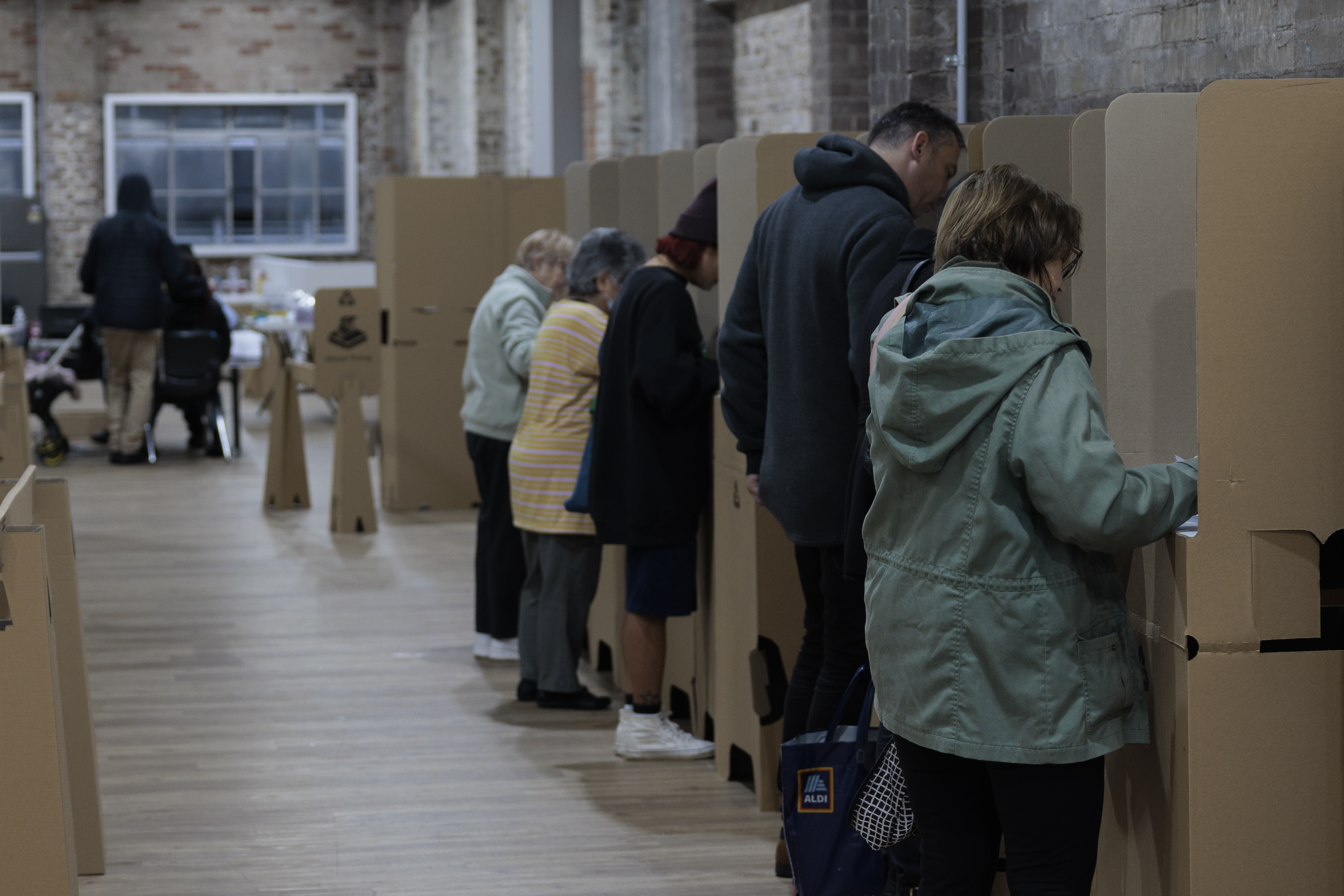 People cast their ballots during early voting for the seat of Wentworth at Oxford Street Mall on May 20, 2022 in Sydney, Australia. Independent Allegra Spender is standing for the seat of Wentworth against Liberal incumbent Dave Sharma. The Australian federal election will be held on Saturday 21 May 2022. (Photo by Brook Mitchell/Getty Images)
