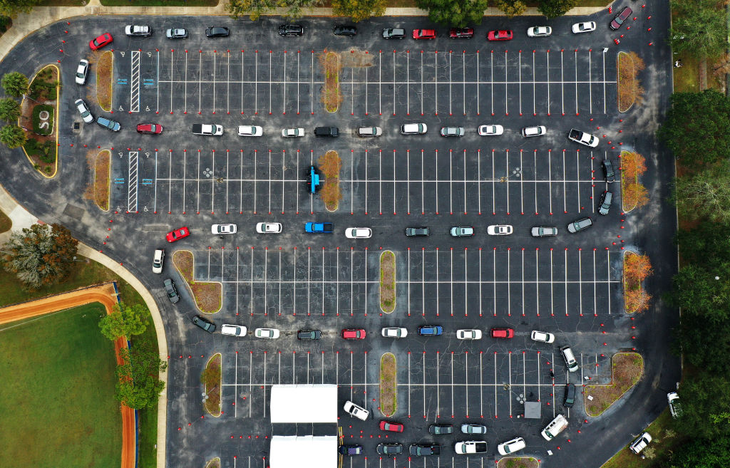 Cars line up at a COVID-19 testing site at the South Orange Youth Sports Complex in Orlando.