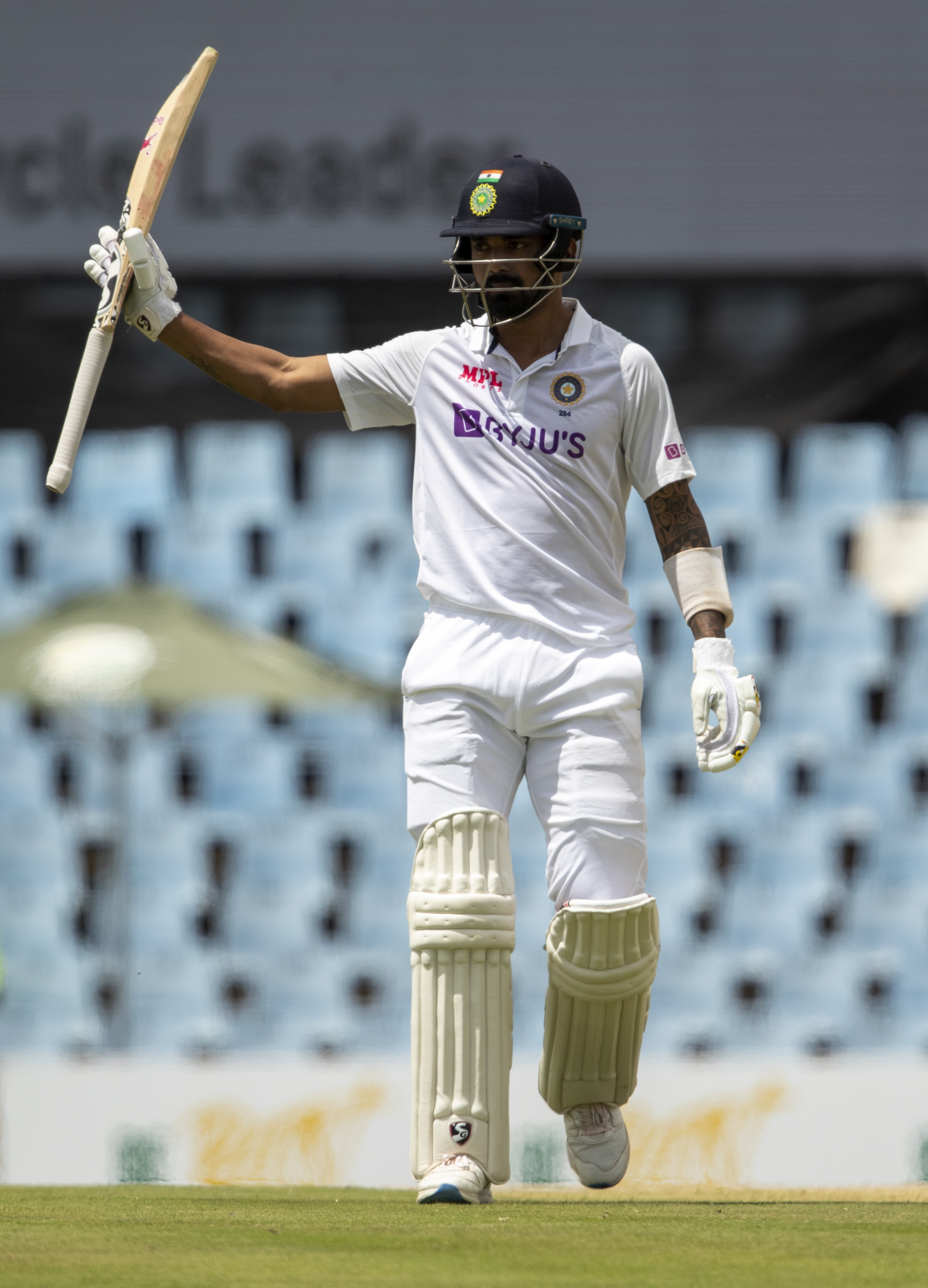 India's KL Rahul raises has bat after reaching a half century during the Test Cricket match between South Africa and India.