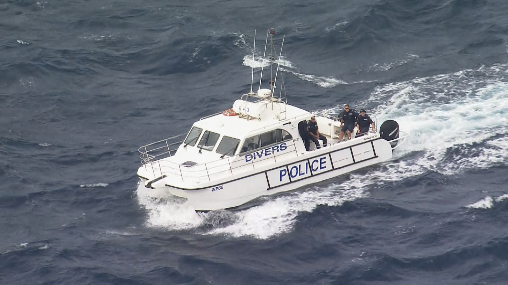 NSW Police divers searching the waters near Dover Heights in Sydney's east today.